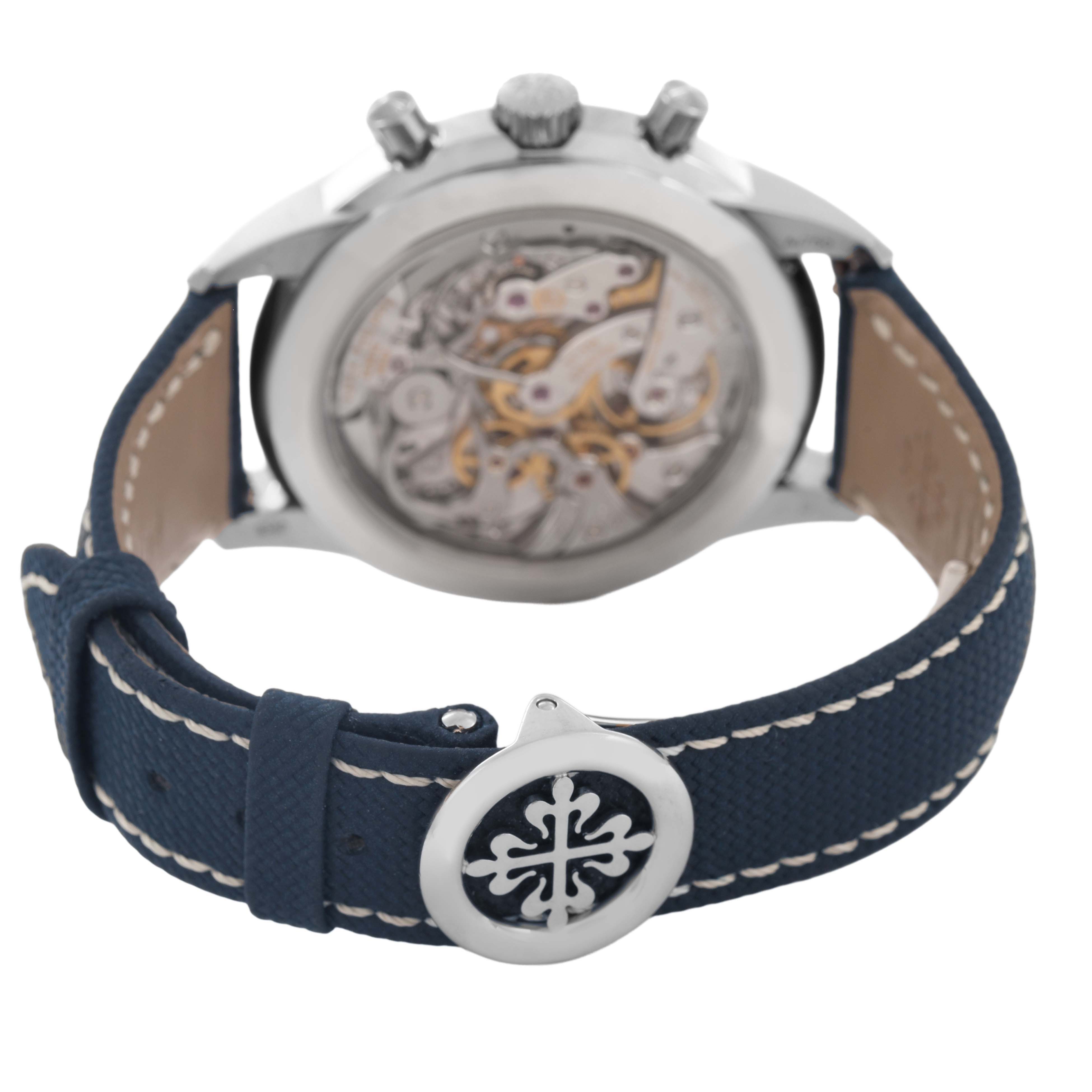 The image shows the back view of a Patek Philippe Complications 5172G-001 Men's White Gold Blue Dial watch, highlighting the movement and blue leather strap.