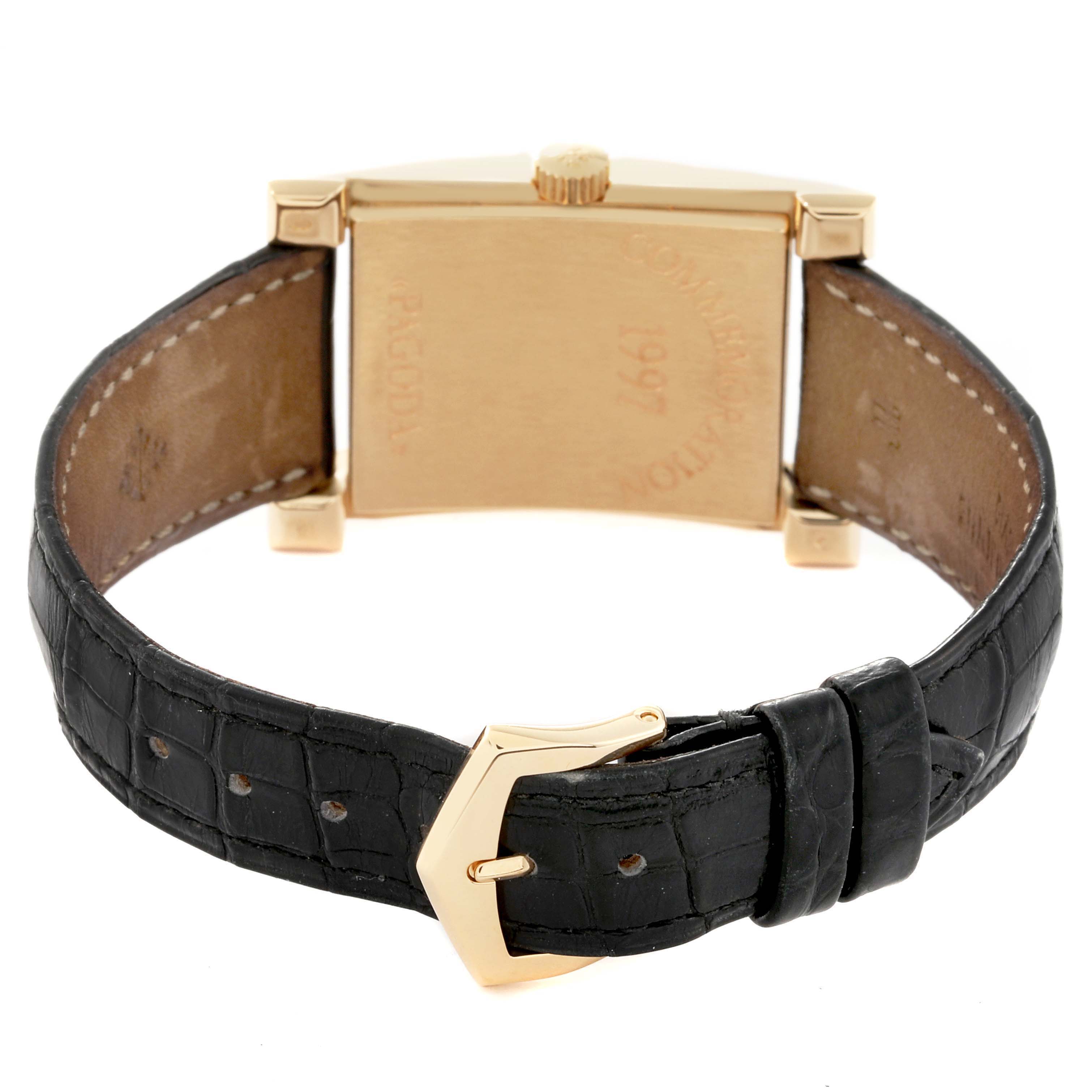 The image shows the back view of a Patek Philippe Pagoda 5500J Men's Yellow Gold Champagne Dial 5500J Men's Yellow Gold Champagne Dial watch, highlighting the case, crown, and black leather strap with a buckle.