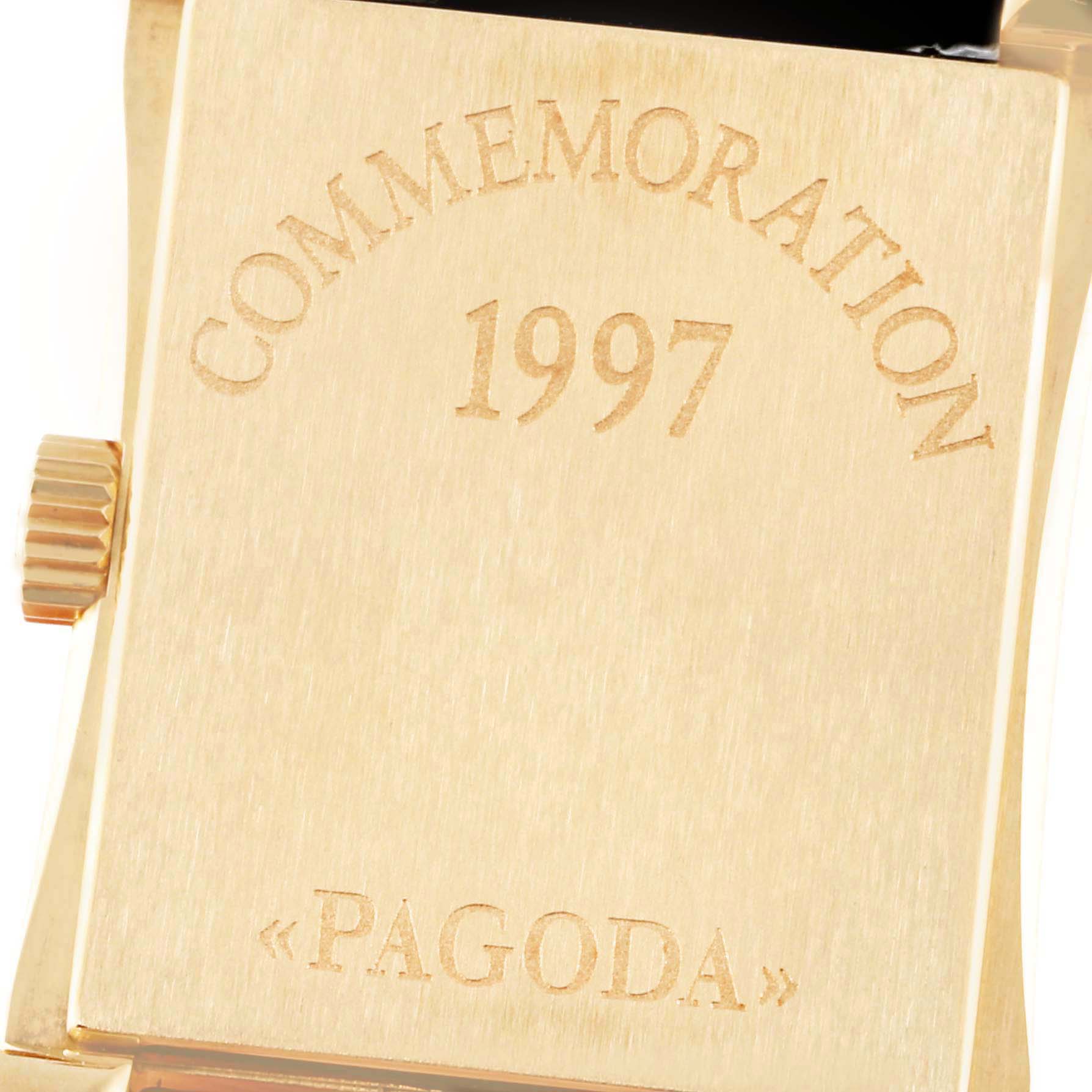 The image shows the back of a Patek Philippe Pagoda 5500J Men's Yellow Gold Champagne Dial 5500J Men's Yellow Gold Champagne Dial watch, featuring engravings including "1997."