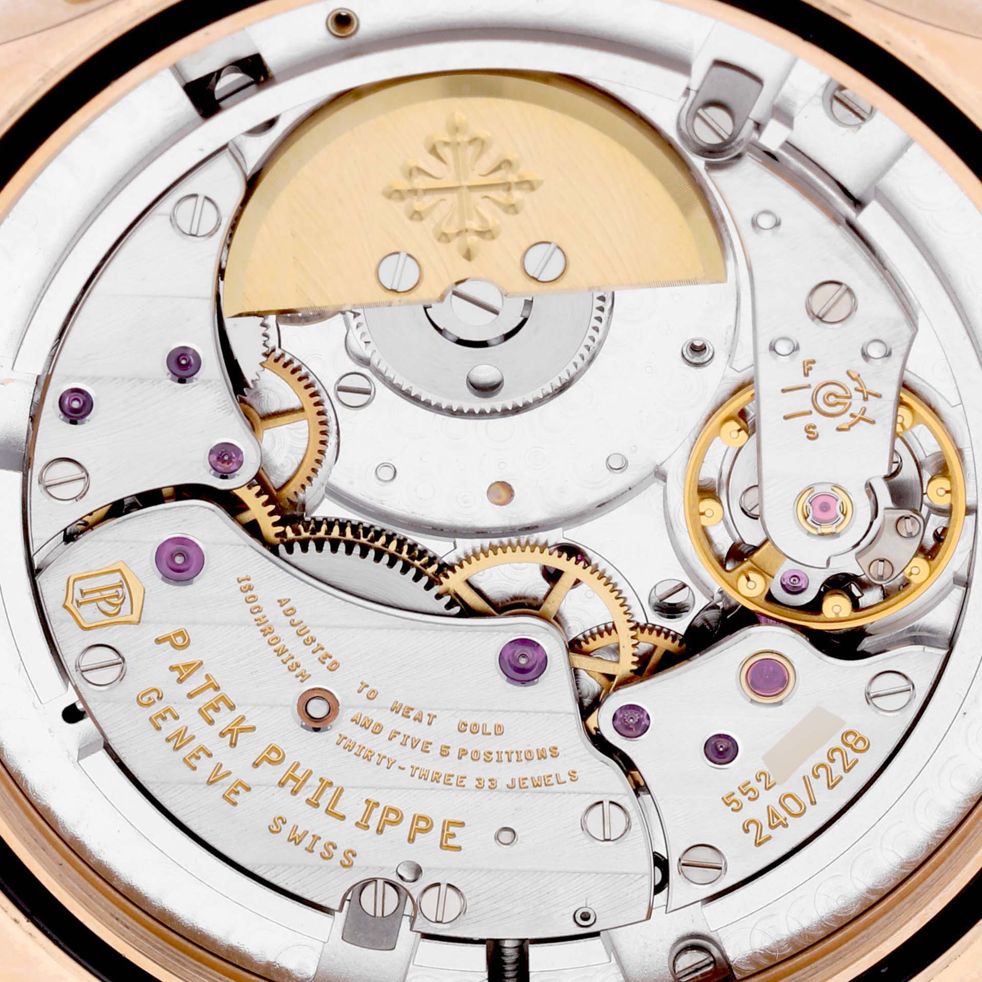 This image of the Patek Philippe Complications 5130R-001 Men
s Rose Gold Silver Dial 5130R-001 Men
s Rose Gold Silver Dial model shows a close-up of the watch
s intricate movement mechanism from the back.