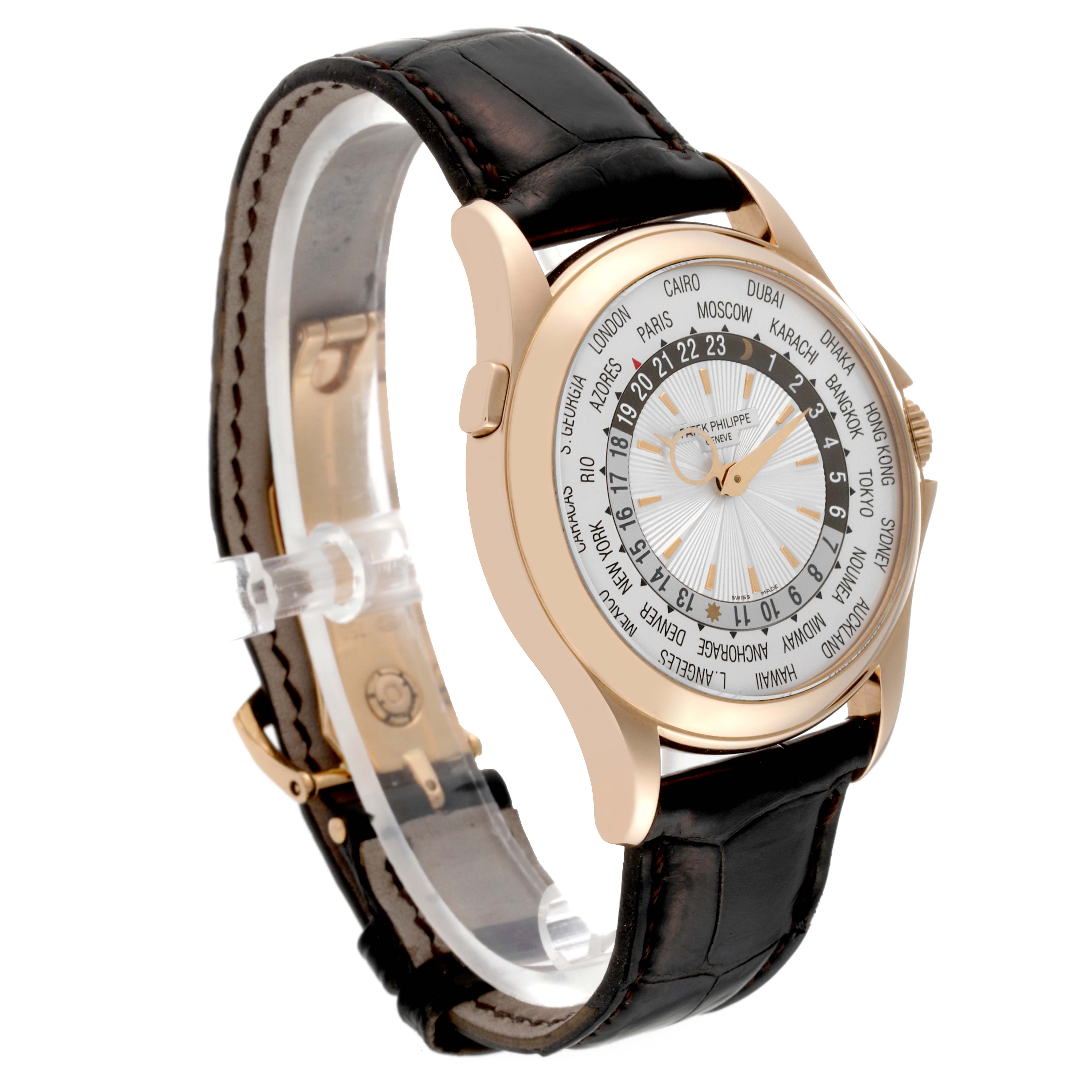 The image shows a side angle view of a Patek Philippe Complications 5130R-001 Men
s Rose Gold Silver Dial 5130R-001 Men
s Rose Gold Silver Dial model with a leather strap and world time display.