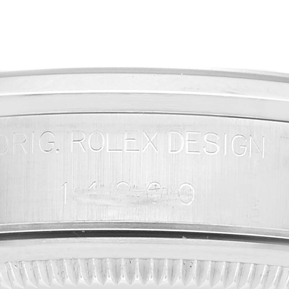 The image shows a close-up of the side of a Rolex Air-King 14000 Men's Stainless Steel Silver Dial 14000 Men's Stainless Steel Silver Dial watch, highlighting the “ORIG. ROLEX DESIGN” engraving and part of the bezel.