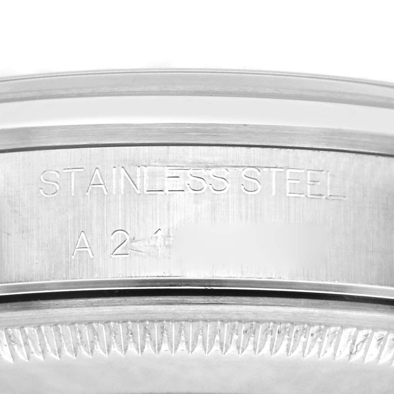 This close-up image shows the side engravings and part of the bezel of a Rolex Air-King 14000 Men's Stainless Steel Black Dial 14000 Men's Stainless Steel Black Dial watch in stainless steel.