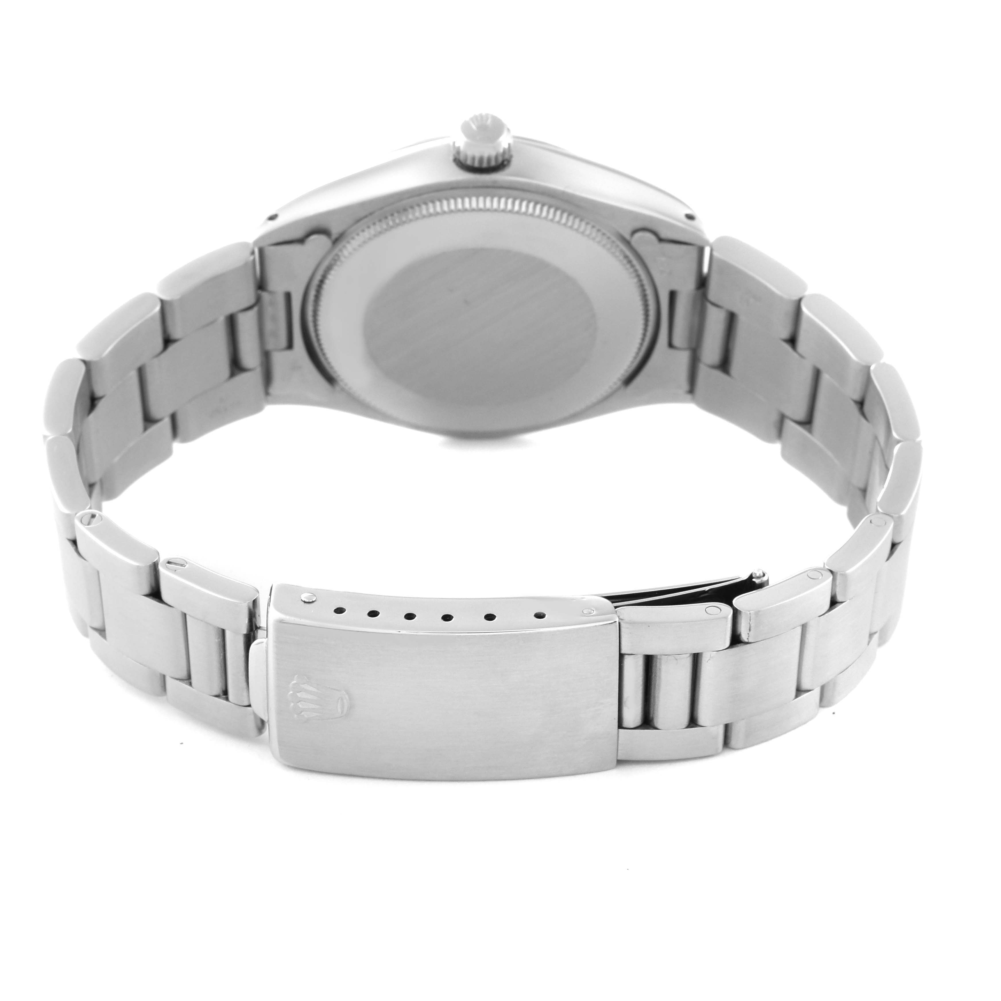 The image shows the Vintage Collection Rolex watch from the rear, highlighting the case back, crown, and metal bracelet with clasp.