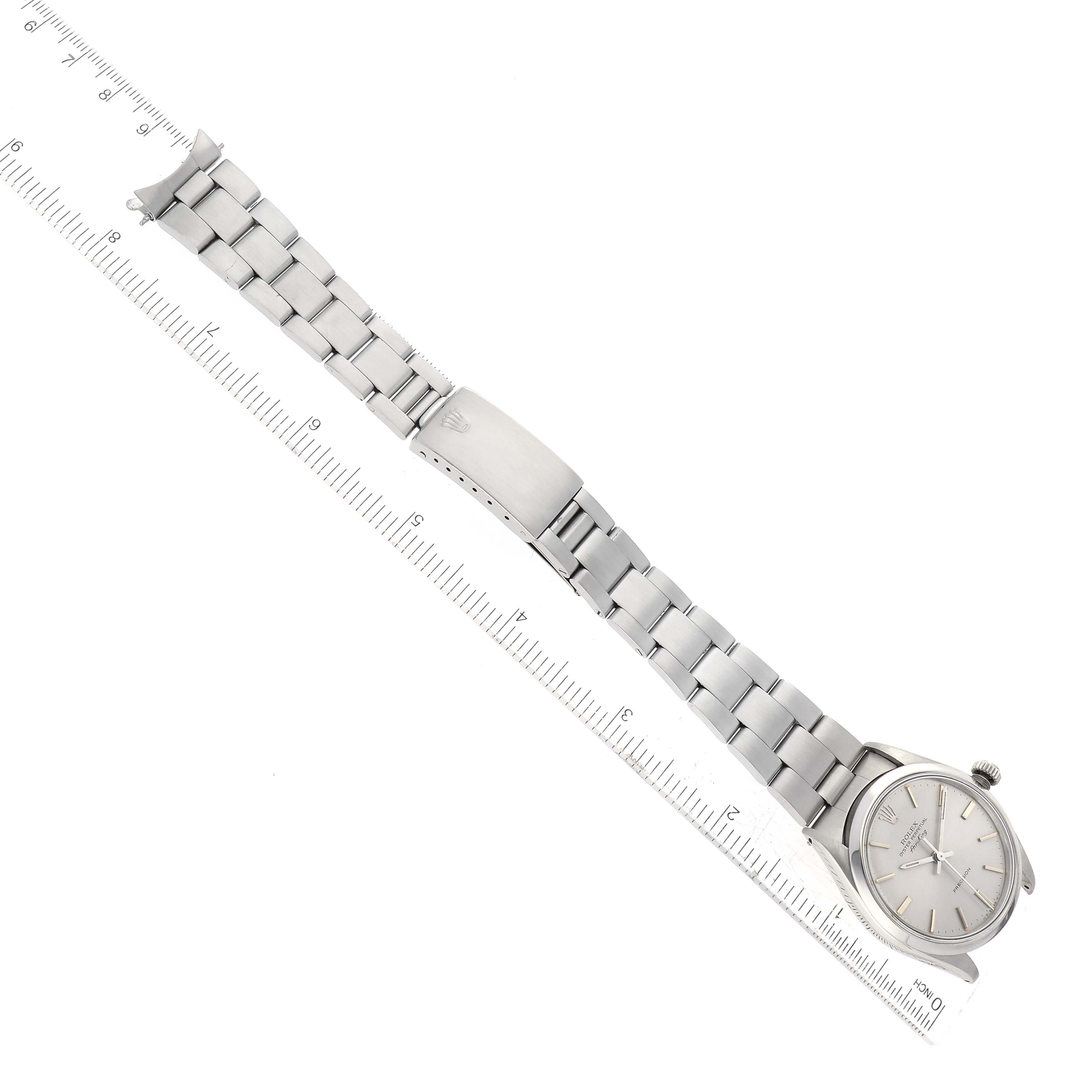 The Rolex Vintage Collection 5500 Men's Stainless Steel Silver Dial 5500 Men's Stainless Steel Silver Dial model watch is shown from a top-down angle, displaying its face, bracelet, clasp, and a ruler for scale.