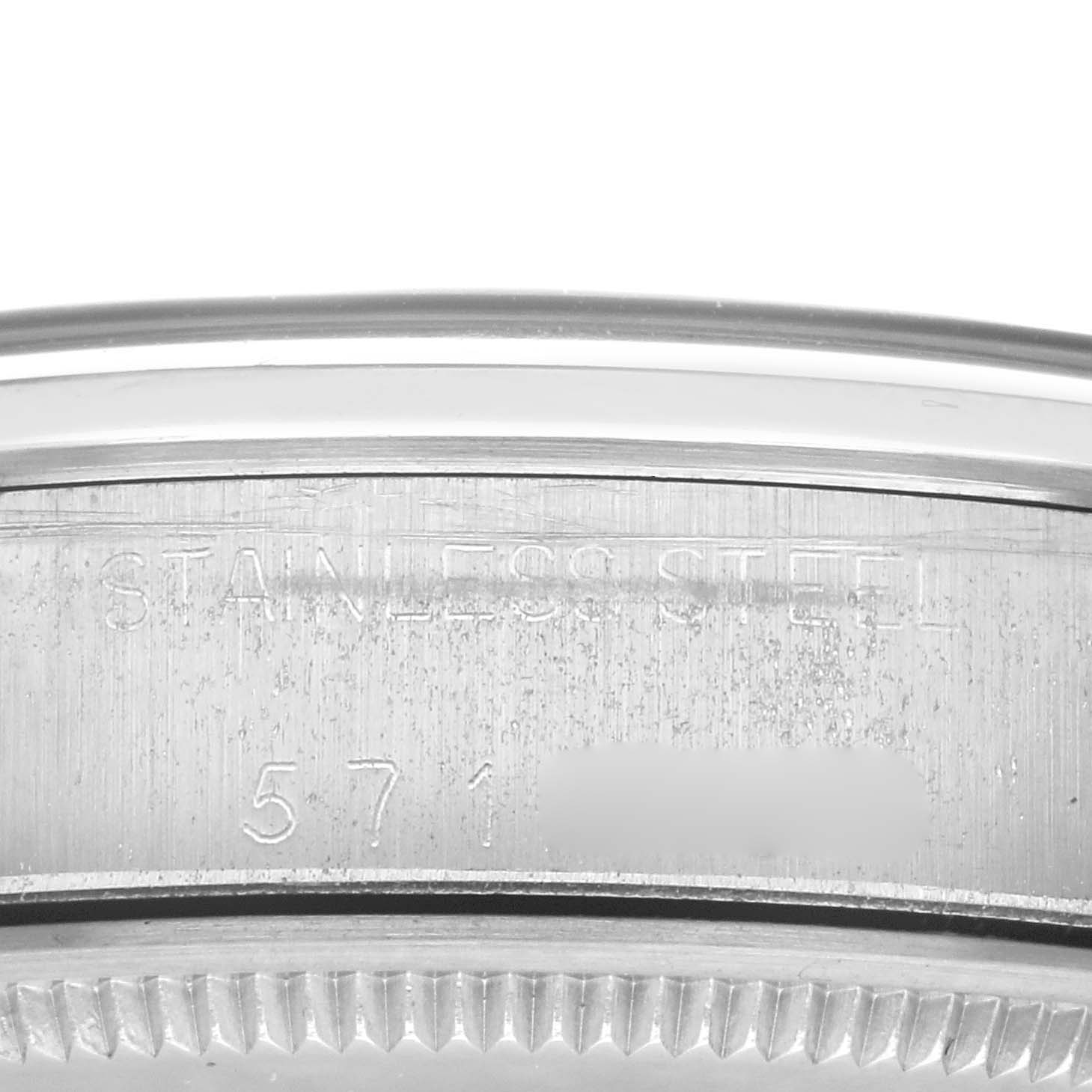 This close-up image shows part of the bezel and case edge of a Rolex Vintage Collection 5500 Men's Stainless Steel Silver Dial 5500 Men's Stainless Steel Silver Dial model, highlighting the "STAINLESS STEEL" engraving.