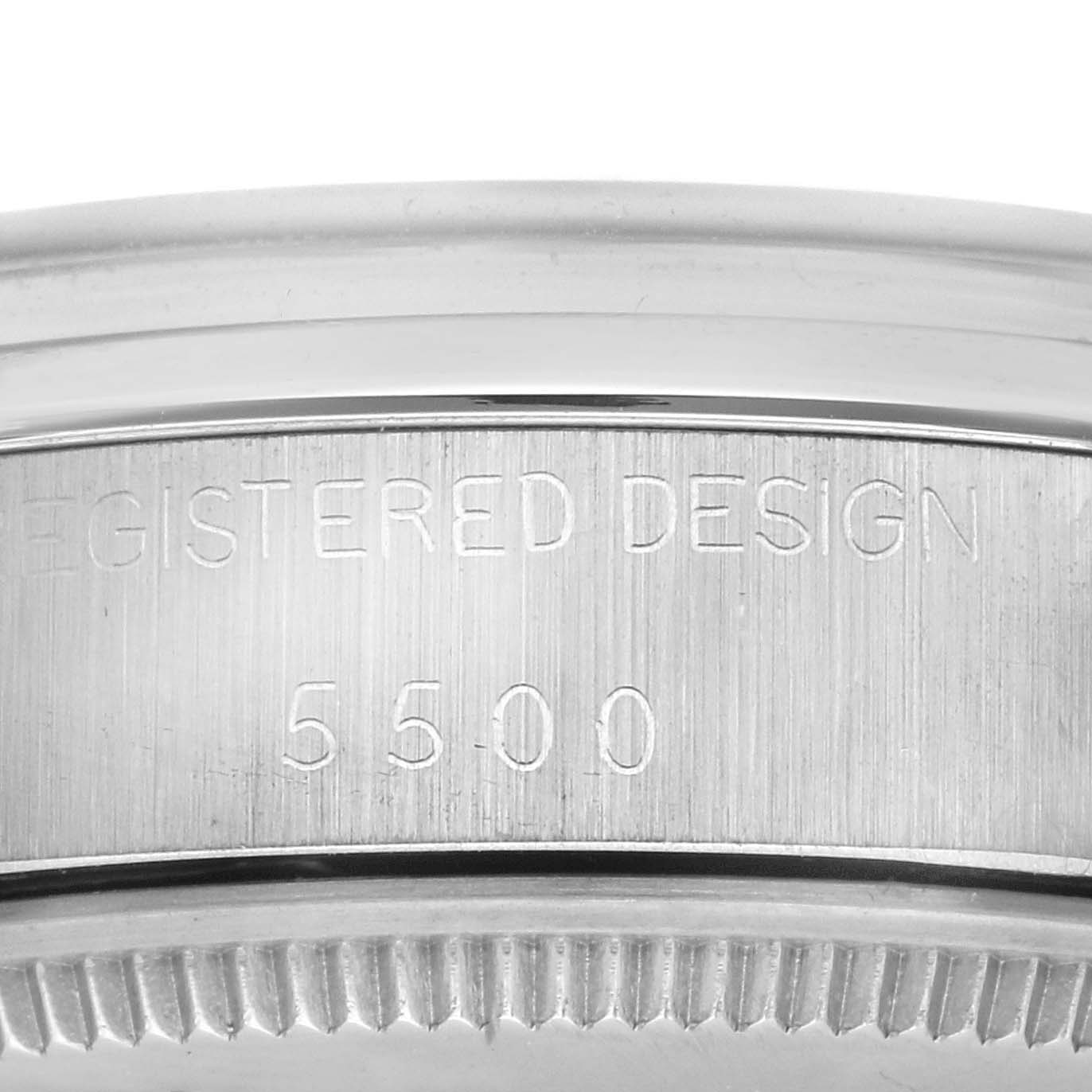 The image shows a close-up of the side of a Rolex Vintage Collection 5500 Men's Stainless Steel Silver Dial 5500 Men's Stainless Steel Silver Dial watch case, highlighting the "REGISTERED DESIGN 5500" engraving.