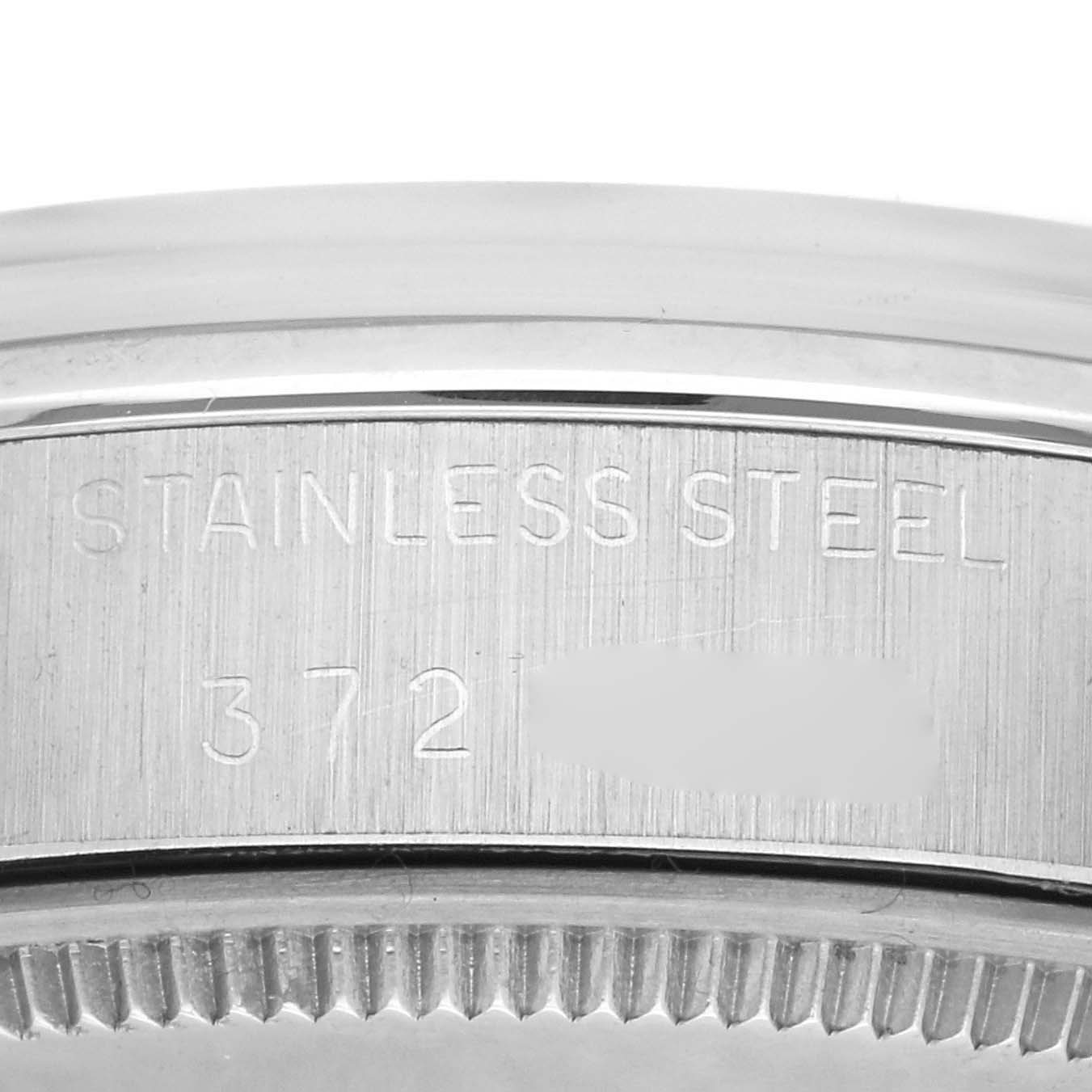 This image shows a close-up of the stainless steel casing engraved with "STAINLESS STEEL" of a Rolex Vintage Collection 5500 Men's Stainless Steel Silver Dial 5500 Men's Stainless Steel Silver Dial watch.