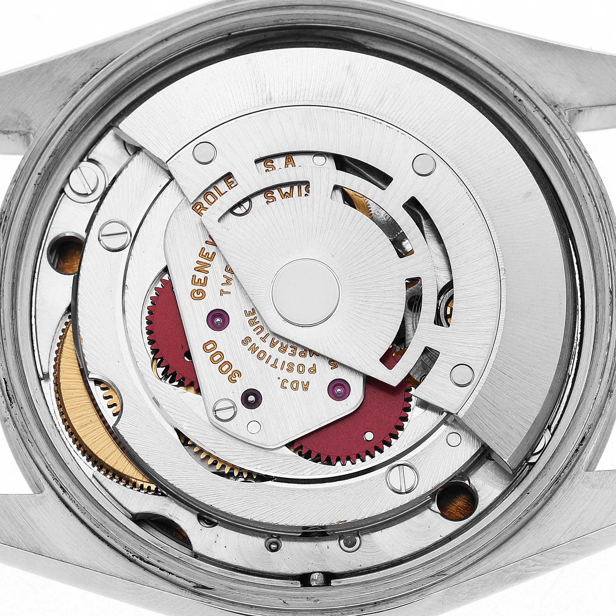 The image shows the movement of a Rolex Air-King 14000 Men's Stainless Steel White Dial watch from the back, highlighting gears and the rotor.