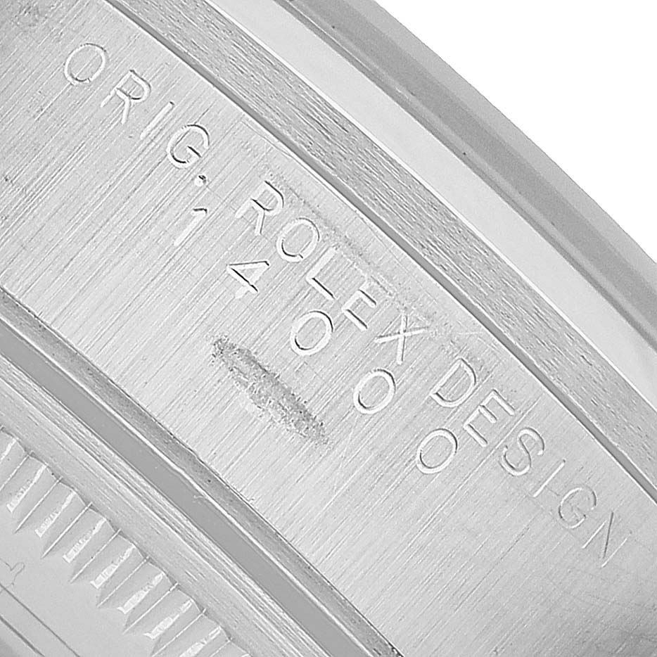 The image shows the engraved casing side of a Rolex Air-King 14000 Men's Stainless Steel White Dial watch, highlighting the "Orig Rolex Design" and model number.