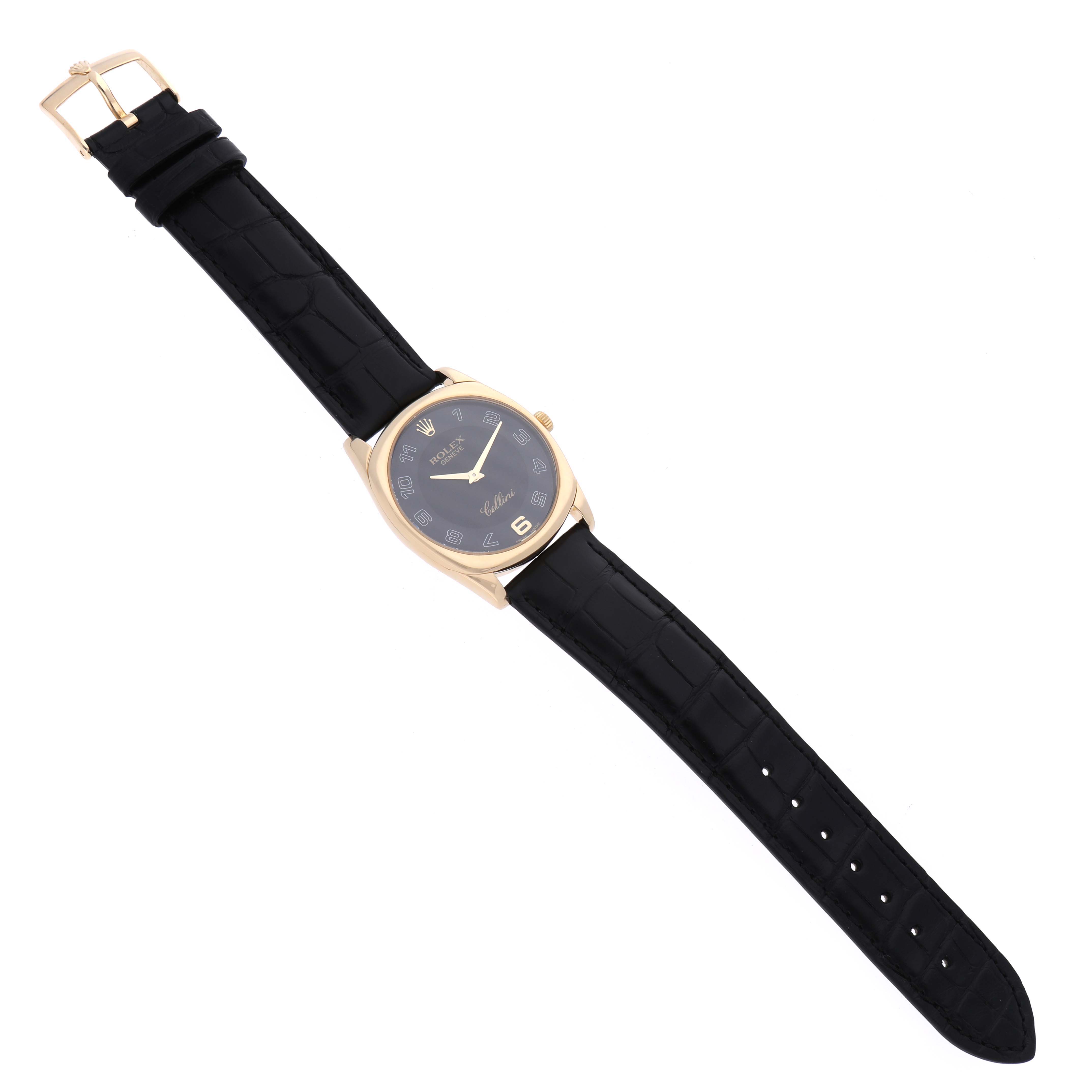 The Rolex Cellini 4233/8 Men's Yellow Gold Black Dial 4233/8 Men's Yellow Gold Black Dial watch is shown from a top-down angle, displaying the face, black leather strap, and gold buckle.