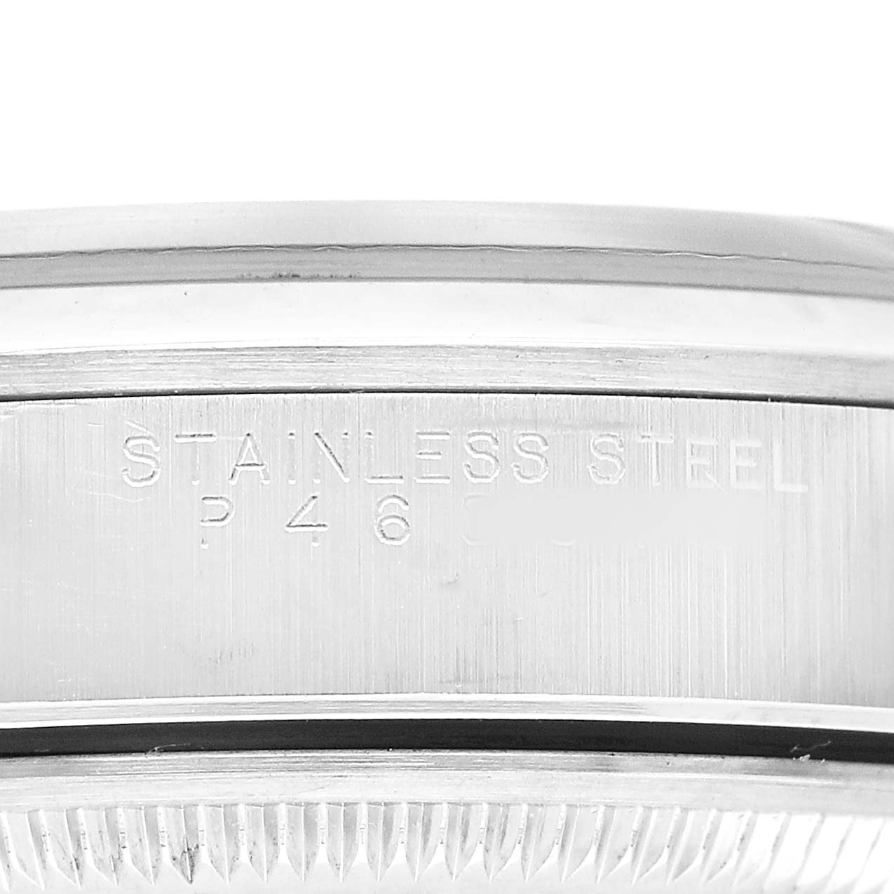 The image shows a close-up side view of a Rolex Date 15200 Men's Stainless Steel Blue Dial model, highlighting the stainless steel engraving on the side of the case.