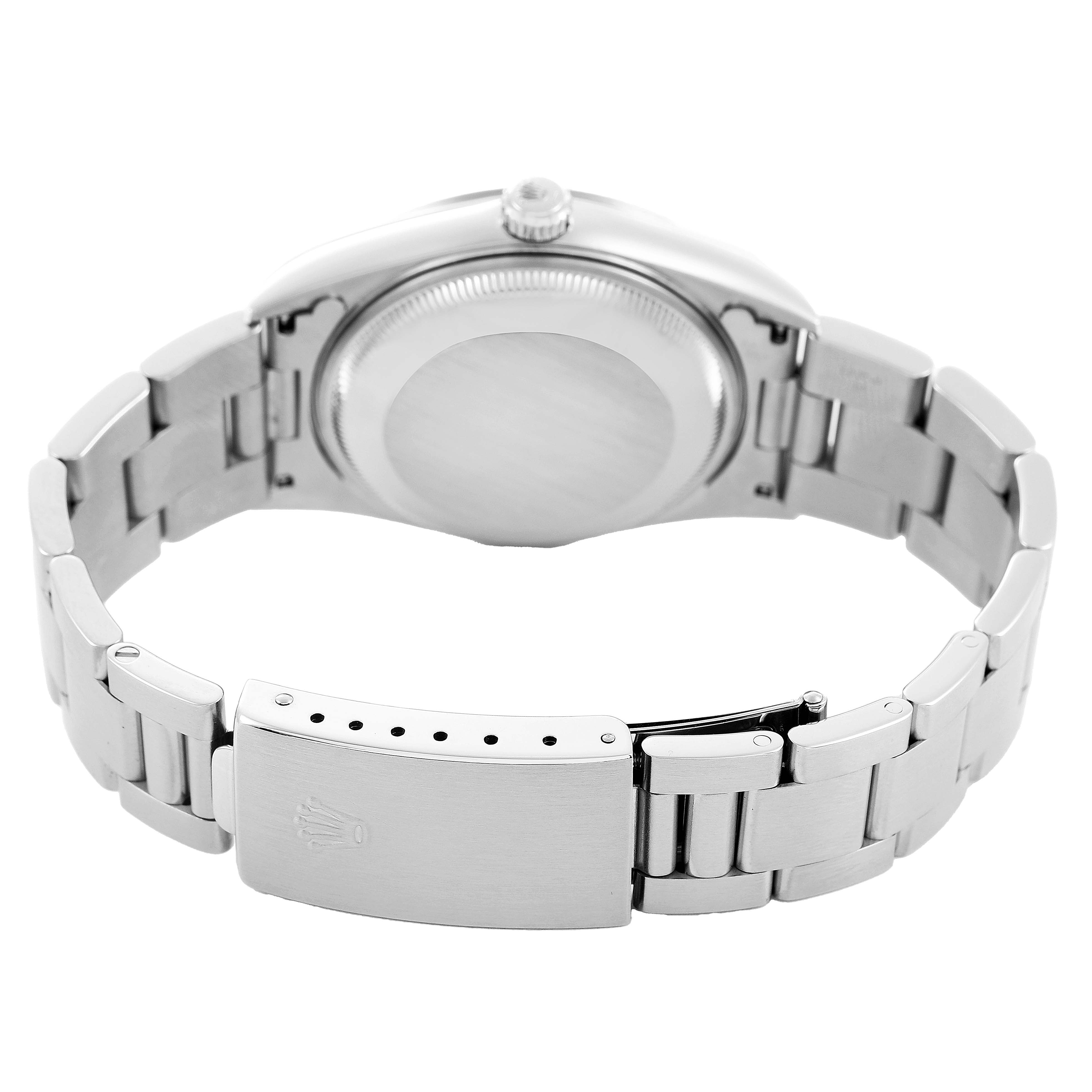 The image shows the backside of a Rolex Date 15200 Men's Stainless Steel Pink Dial model, focusing on the case back, crown, and bracelet with clasp.