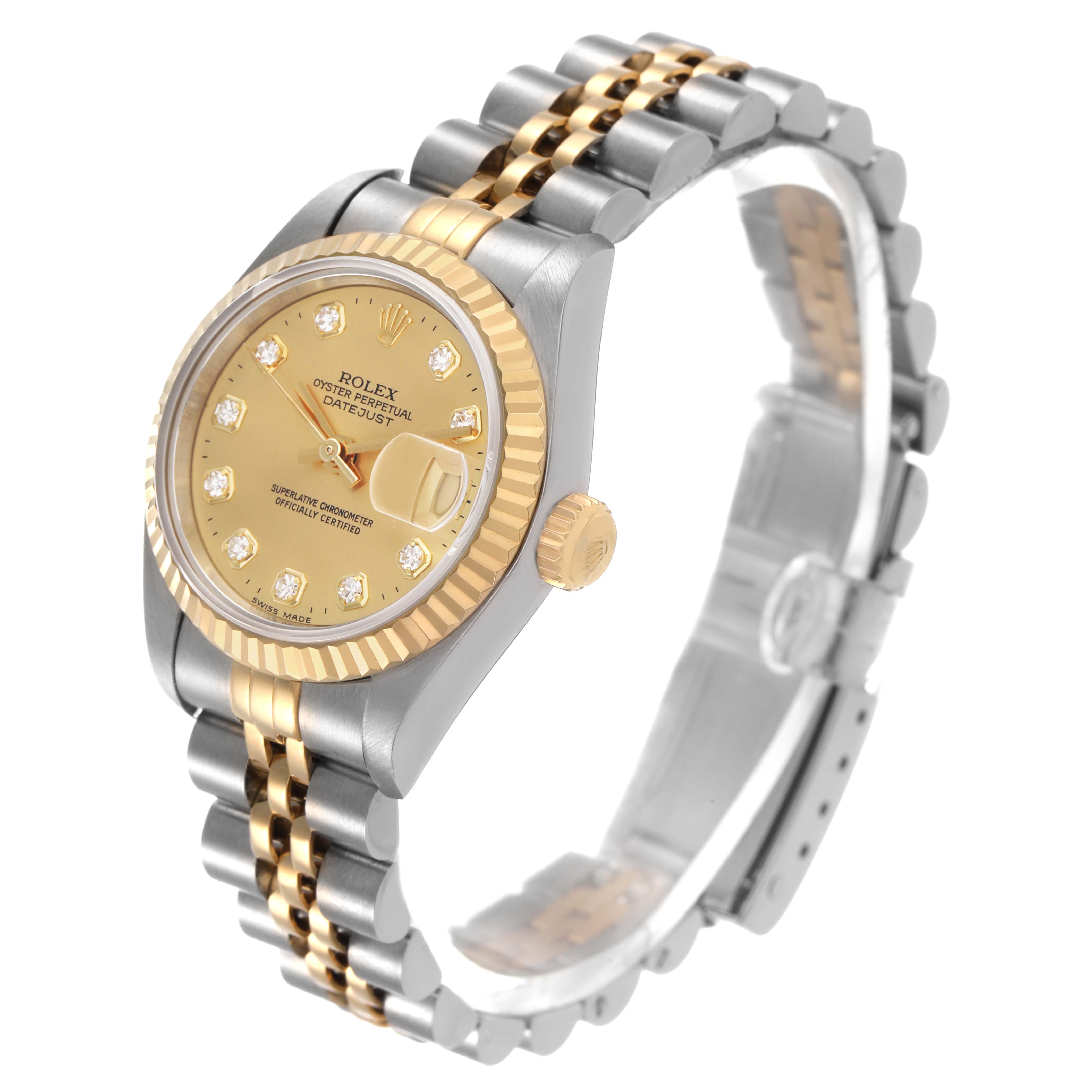 The Rolex Datejust 69173 Women's Steel and Gold (two tone) Champagne Dial watch is shown at a three-quarter angle, highlighting its gold dial, bezel, crown, and two-tone bracelet.