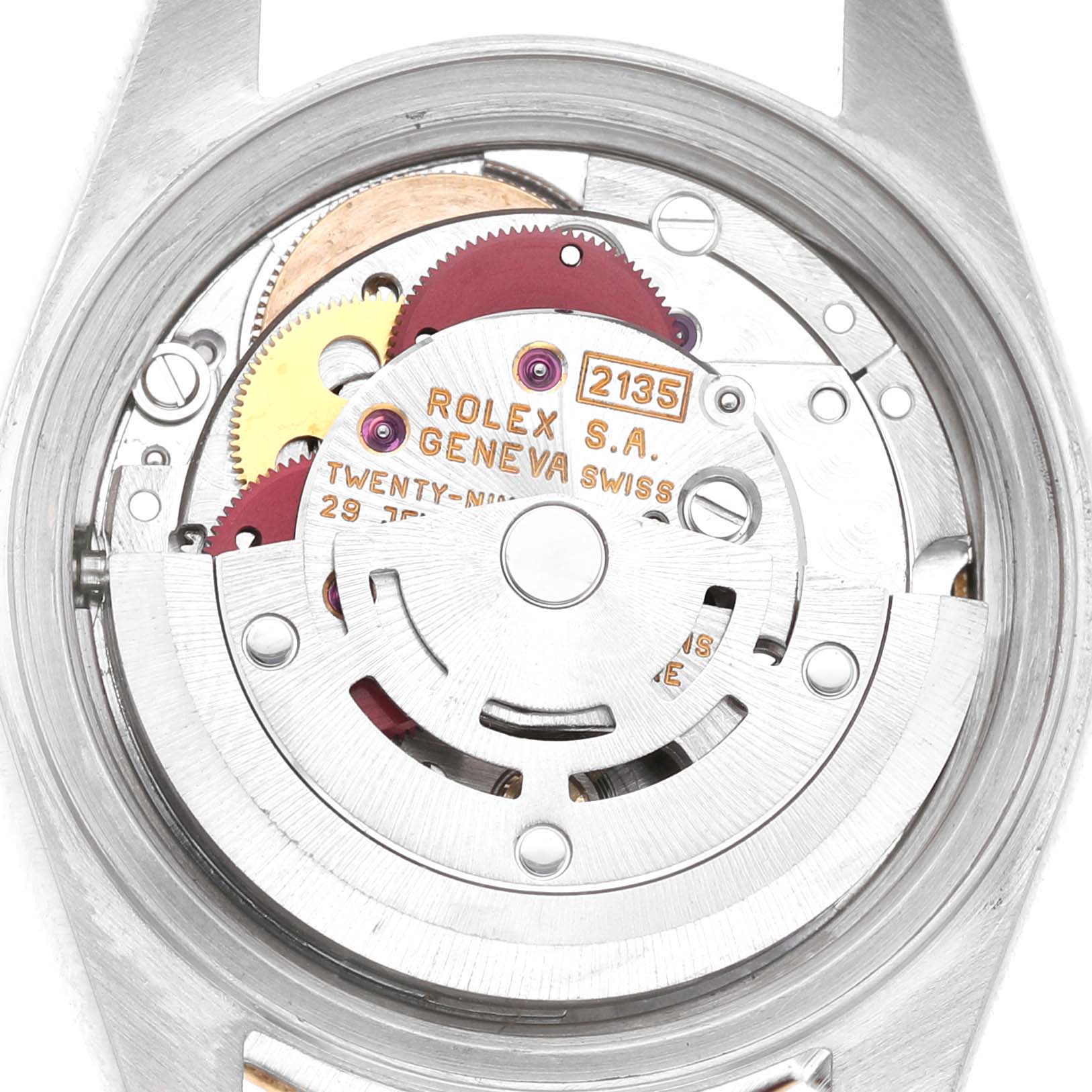 The image shows the movement and inner mechanism of a Rolex Datejust 69173 Women's Steel and Gold (two tone) Champagne Dial watch from a back angle, revealing gears and inscriptions.