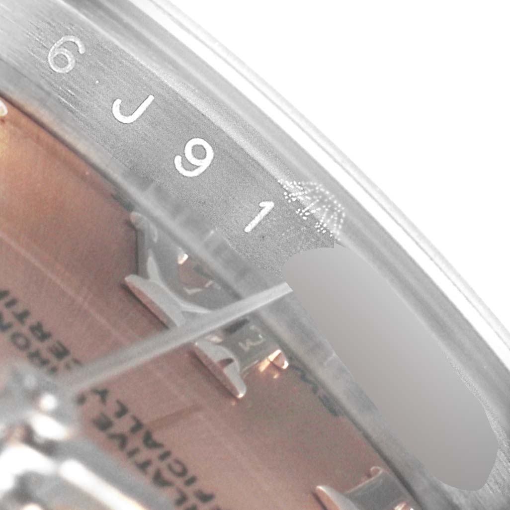 This image shows a close-up of the serial number engraving and part of the dial on a Rolex Datejust 279160 Women's Stainless Steel Pink Dial 279160 Women's Stainless Steel Pink Dial watch.