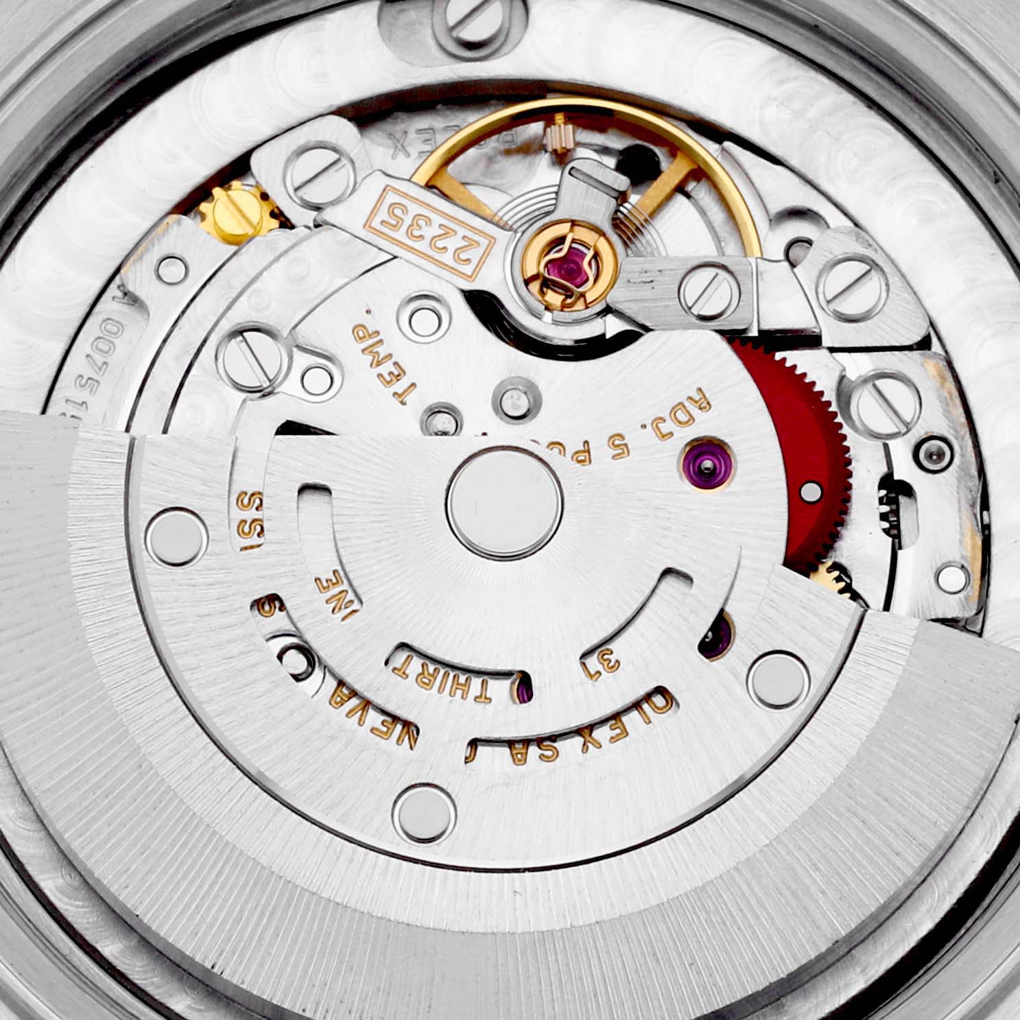The image shows a close-up of the internal mechanism of a Rolex Mid-Size 78240 Women's Stainless Steel Pink Dial 78240 Women's Stainless Steel Pink Dial watch, highlighting its intricate movement components and engravings.