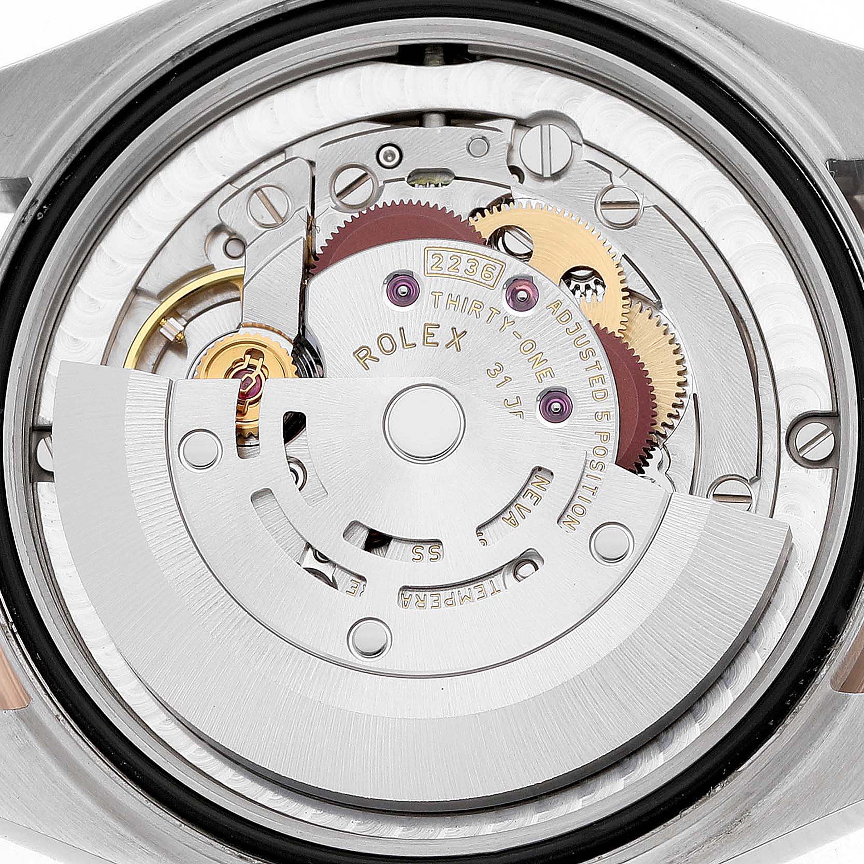 The image shows the back of a Rolex Mid-Size 278271 Women's Steel and Gold (two tone) Pink Dial watch, highlighting its intricate movement components.