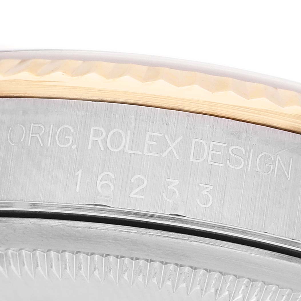 The image shows a close-up side view of the Rolex Datejust 16233 Men's Stainless Steel White Dial model, focusing on the engraved case design and bezel.