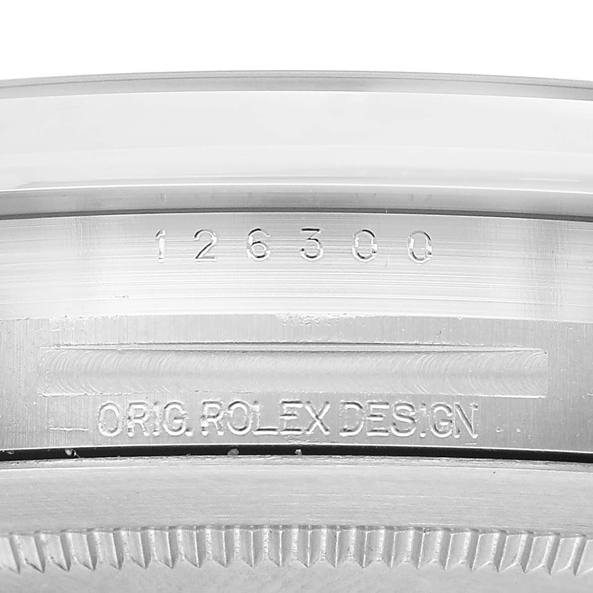 The image shows a close-up of the Rolex Datejust 41 126300 Men's Stainless Steel White Dial model's case, focusing on the engraved reference number and design details.