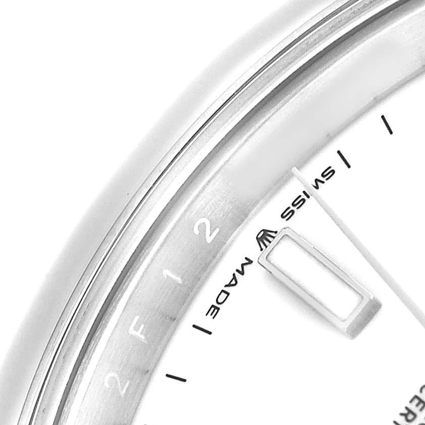 The image shows a close-up of the dial edge and part of the bezel of the Rolex Datejust 41 126300 Men's Stainless Steel White Dial, highlighting the "Swiss Made" text.