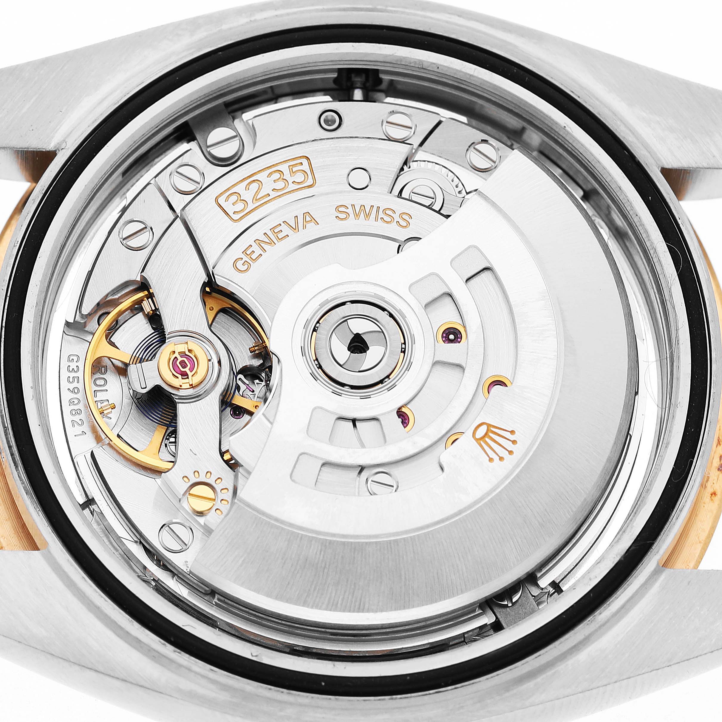 The image shows the movement from the back of a Rolex Datejust 41 126333 Men's Steel and Gold (two tone) Silver Dial, highlighting the rotor and intricate mechanics.