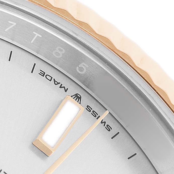 The image shows a close-up of the Rolex Datejust 41 126333 Men's Steel and Gold (two tone) Silver Dial watch, featuring the dial, markers, and part of the fluted bezel.
