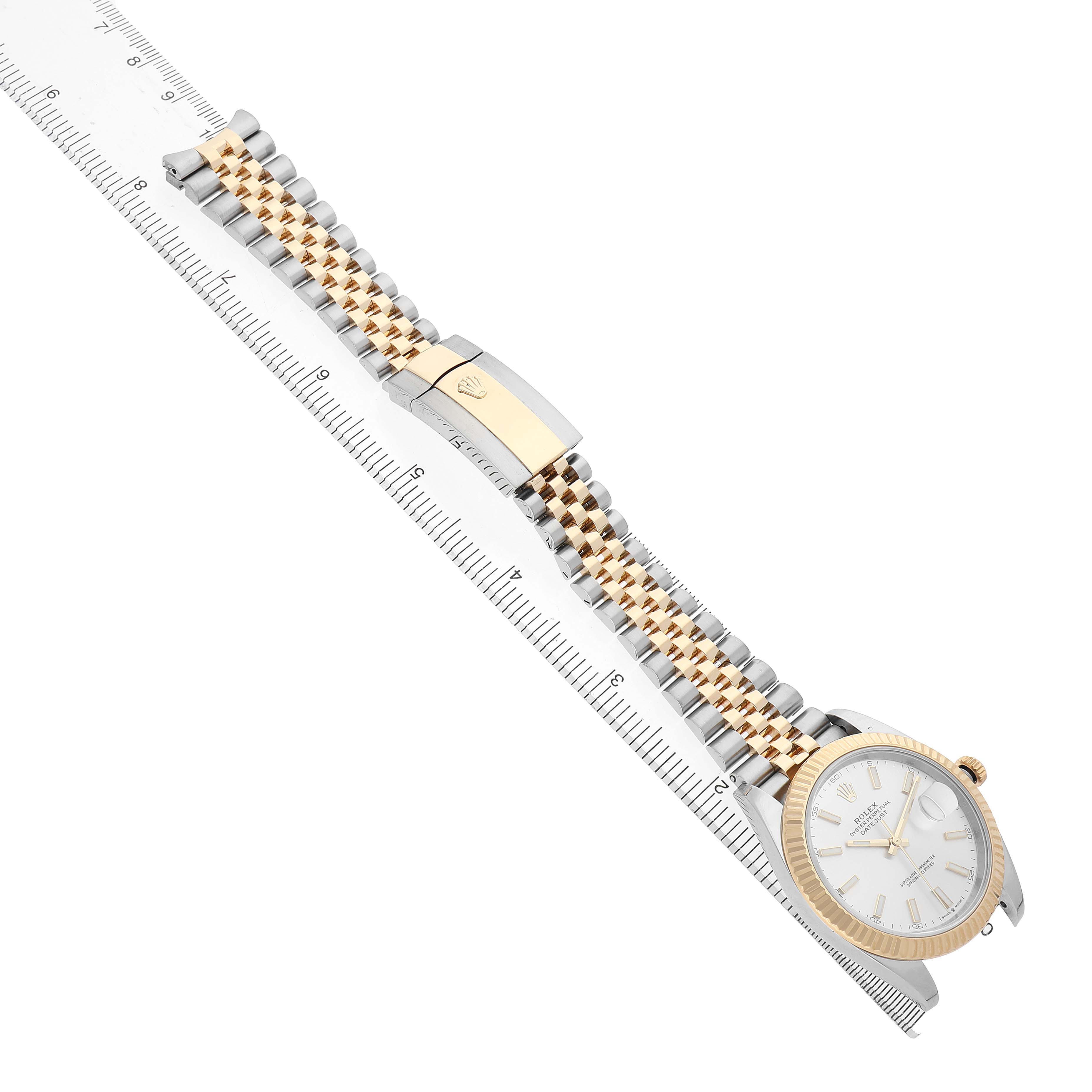 The Rolex Datejust 41 126333 Men's Steel and Gold (two tone) Silver Dial is shown from a diagonal top view, highlighting the face, gold fluted bezel, and jubilee bracelet.