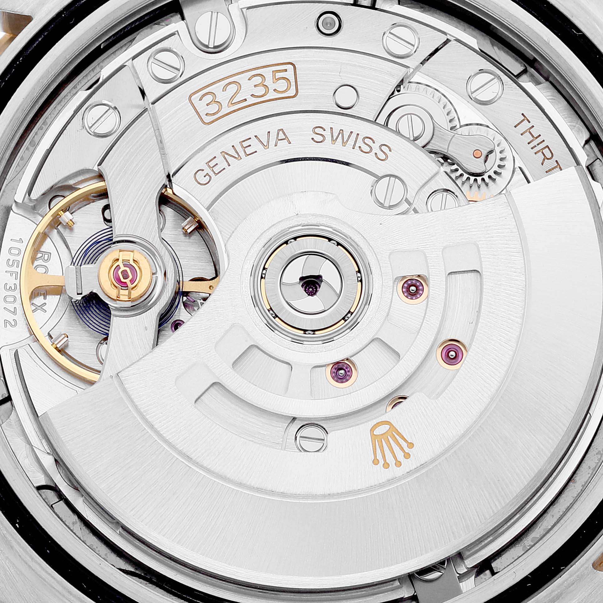 This is a close-up of the Rolex Datejust 41 126333 Men's Steel and Gold (two tone) Grey Dial 126333 Men's Steel and Gold (two tone) Grey Dial's movement mechanism, showcasing its intricate parts and "3235" caliber.