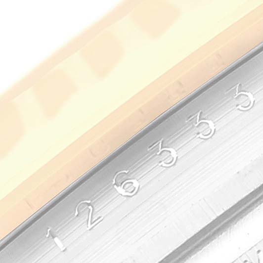 This image shows a close-up of the fluted bezel of a Rolex Datejust 41 126333 Men's Steel and Gold (two tone) Grey Dial 126333 Men's Steel and Gold (two tone) Grey Dial watch, highlighting the etched numbers.
