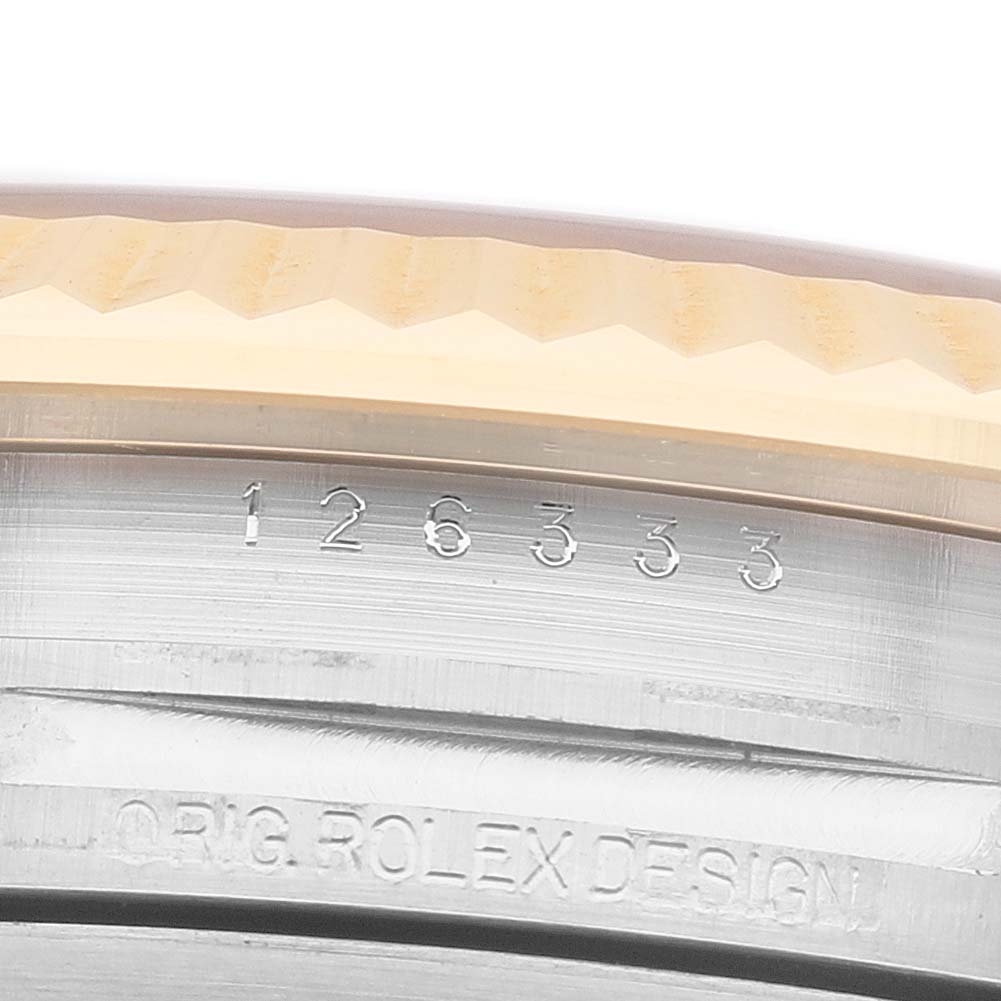 The image shows the side of a Rolex Datejust 41 126333 Men's Steel and Gold (two tone) Grey Dial, focusing on the engraved bezel and model number.