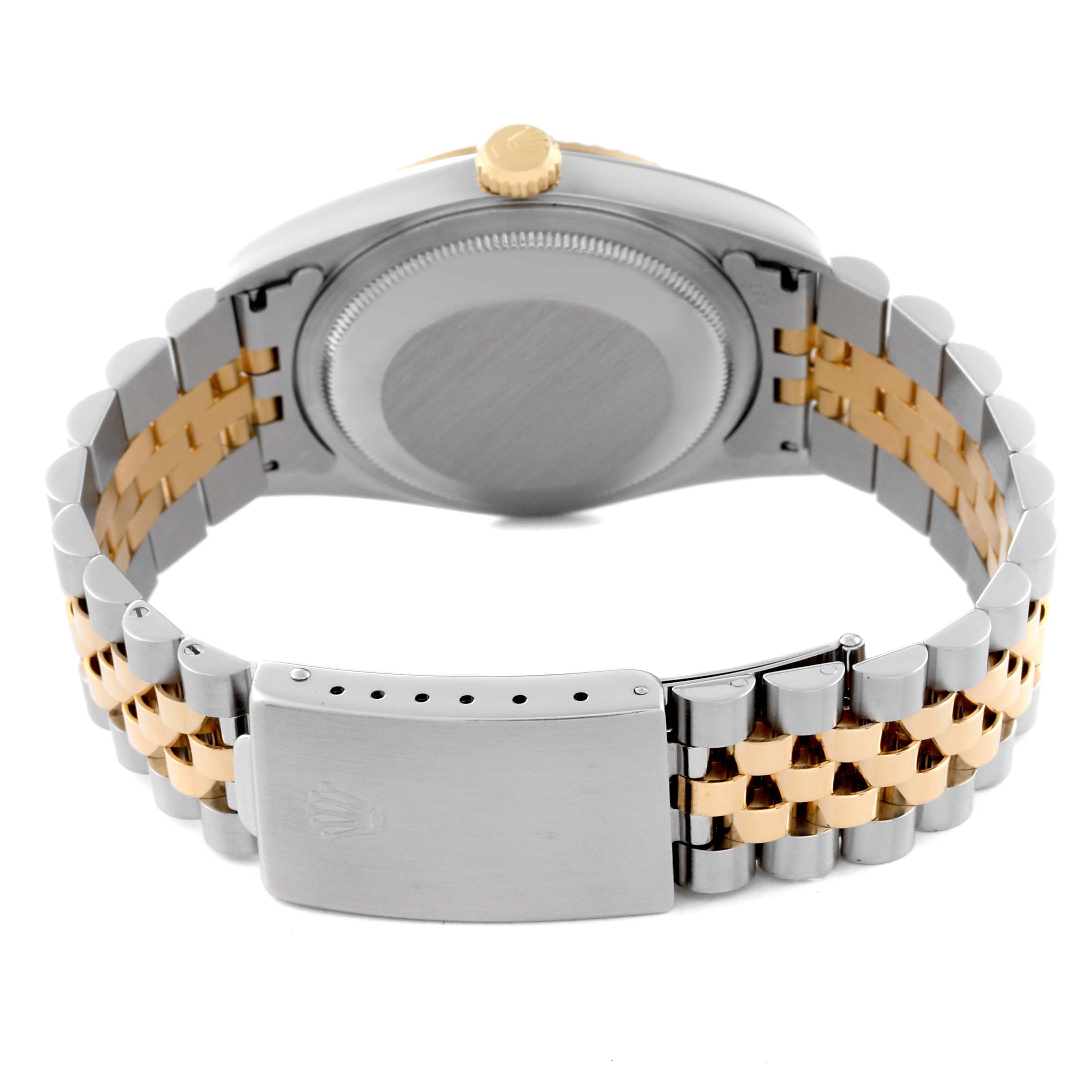 The image shows the back view of a Rolex Datejust 16233 Men's Steel and Gold (two tone) Blue Dial 16233 Men's Steel and Gold (two tone) Blue Dial watch, highlighting its case back, crown, and two-tone Jubilee bracelet with clasp.