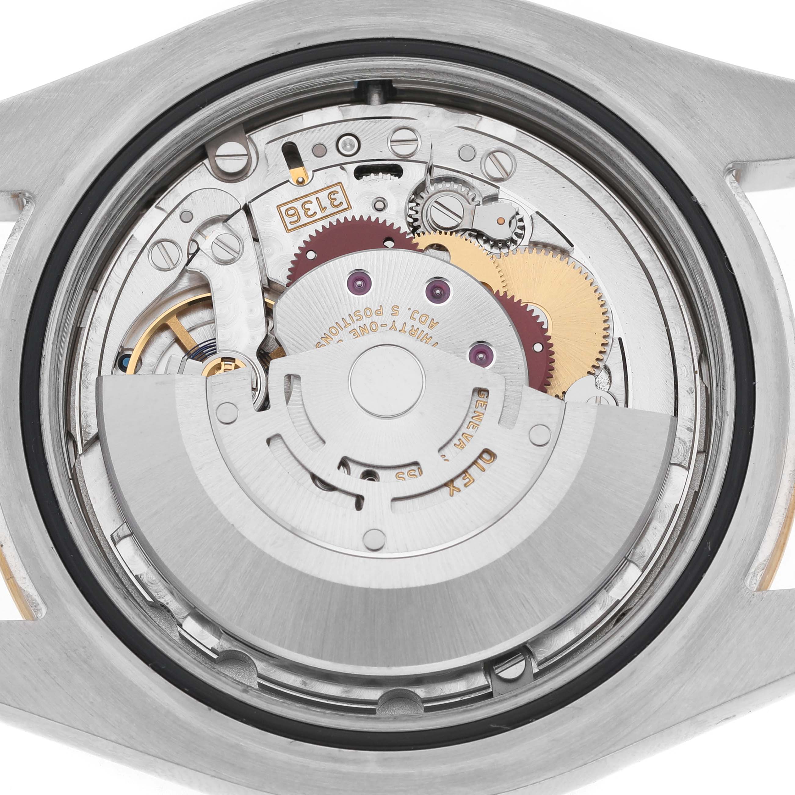 The image shows the movement of a Rolex Datejust 41 116333 Men's Steel and Gold (two tone) Silver Dial from a back angle, highlighting its intricate gears and rotor.