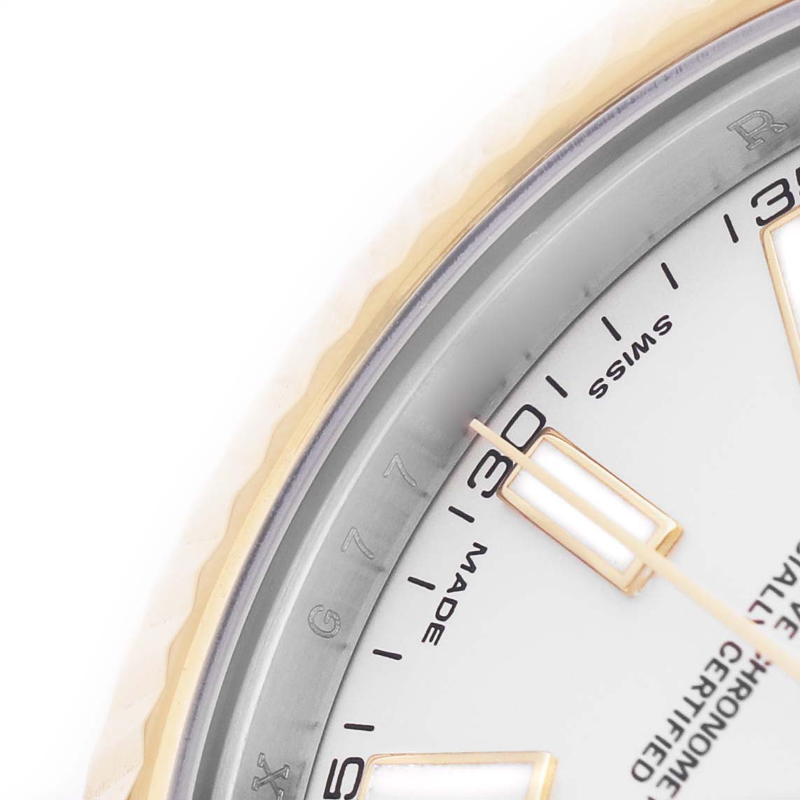 The image shows a close-up of the dial and bezel of a Rolex Datejust 41 116333 Men's Steel and Gold (two tone) Silver Dial, highlighting the hour markers and part of the fluted bezel.
