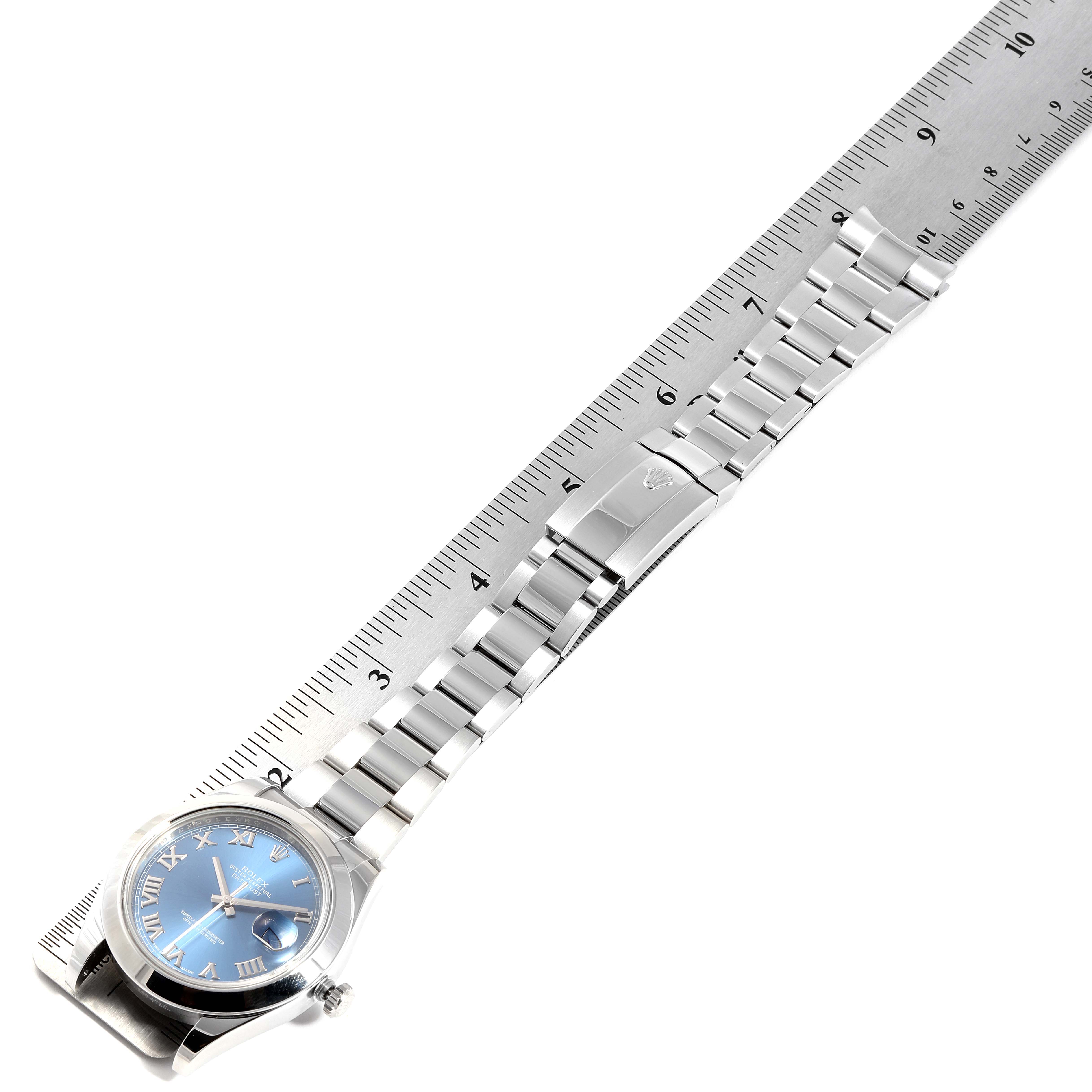 The image shows a Rolex Datejust 41 116300 Men's Stainless Steel Blue Dial 116300 Men's Stainless Steel Blue Dial watch laid flat with a ruler, displaying the face, bracelet, and clasp.