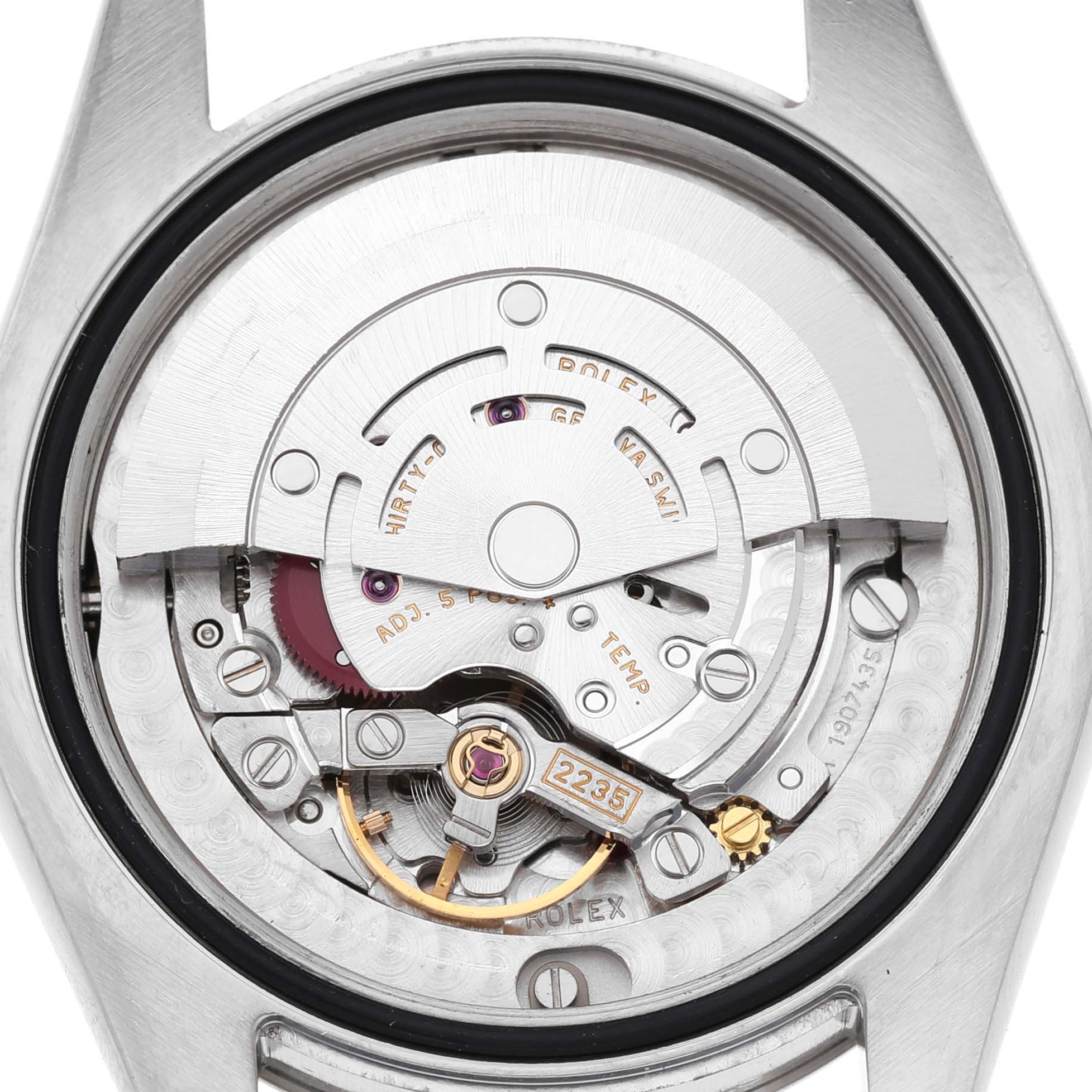 The image shows the inner mechanical movement of a Rolex Mid-Size 178274 Women's Stainless Steel Black Dial watch viewed from the back.