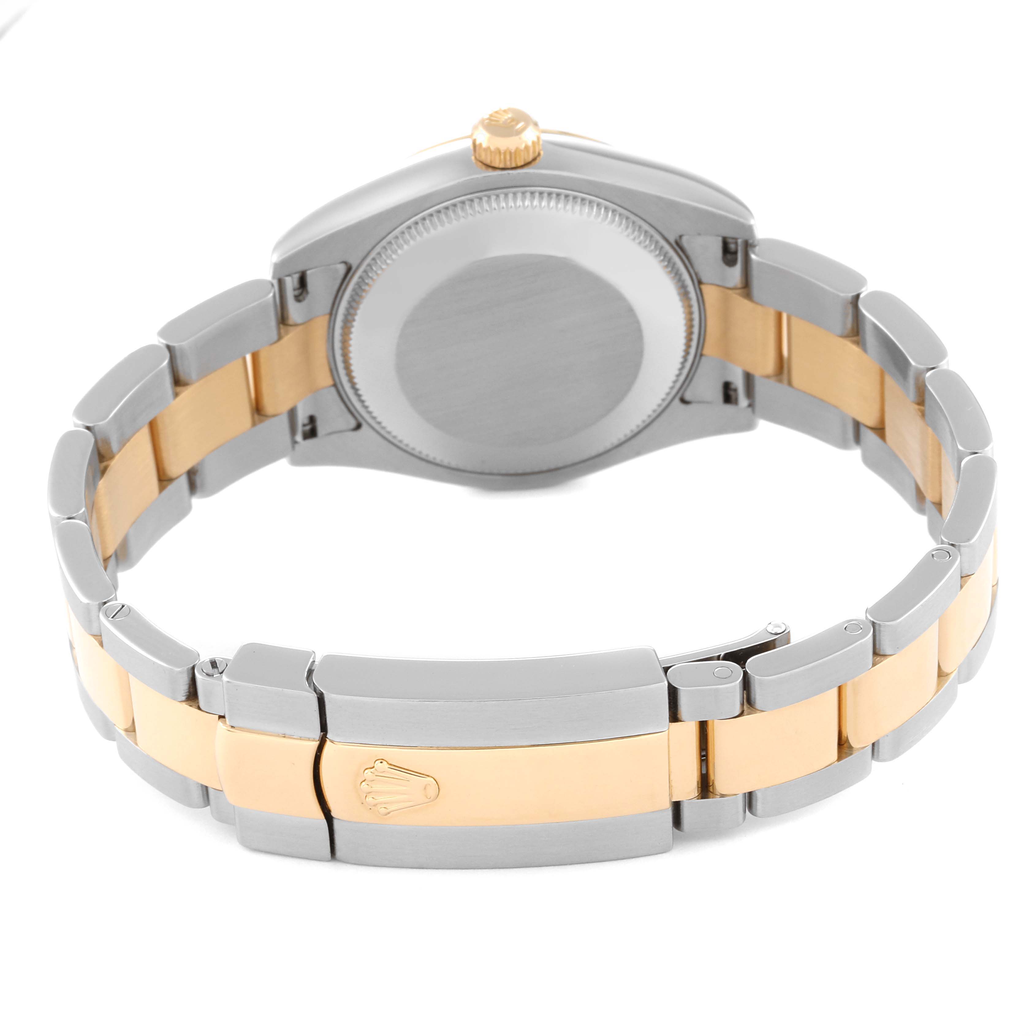 The image shows the back case and bracelet of a Mid-Size Rolex watch, highlighting its two-tone metal design and clasp with the Rolex logo.