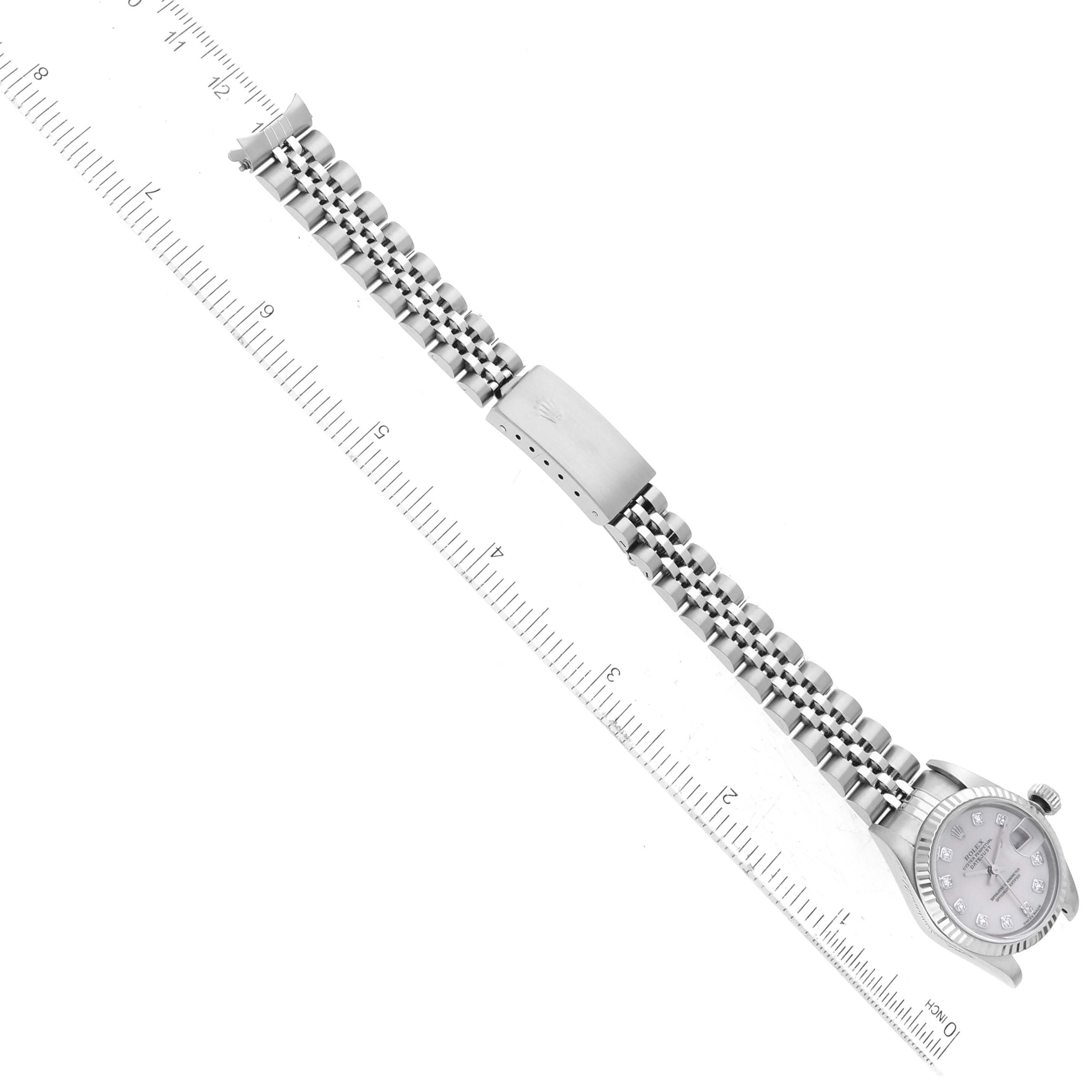 The image shows a side view of a Rolex Datejust 79174 Women's Stainless Steel Mother of Pearl Dial 79174 Women's Stainless Steel Mother of Pearl Dial watch, including the face, clasp, and full bracelet, measured against a ruler.