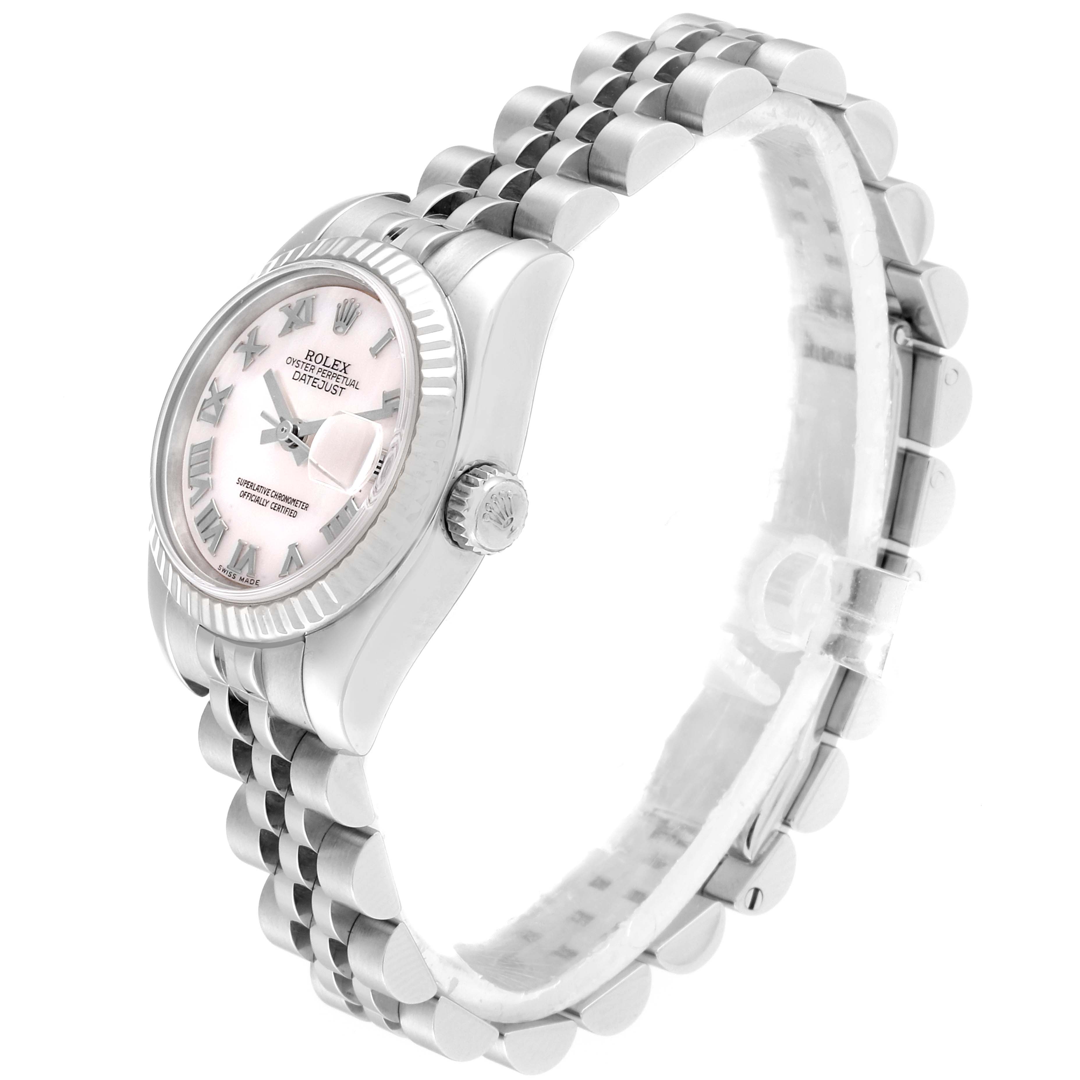 The image shows a side view of the Rolex Datejust 179174 Women
s Stainless Steel Mother of Pearl Dial 179174 Women
s Stainless Steel Mother of Pearl Dial watch, highlighting its pink dial, Roman numerals, fluted bezel, and Jubilee bracelet.