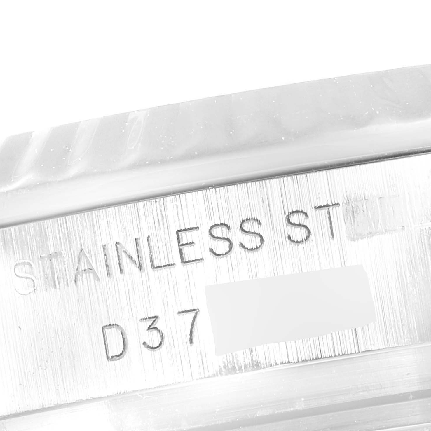 This image shows a close-up of the side of a Rolex Datejust 179174 Women
s Stainless Steel Mother of Pearl Dial 179174 Women
s Stainless Steel Mother of Pearl Dial watch, highlighting the "STAINLESS STEEL" engraving.