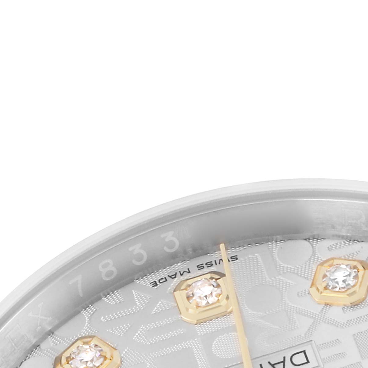 The image shows a close-up of the Rolex Datejust 116233 watch dial, highlighting diamond hour markers, part of the "Swiss Made" text, and the edge of the bezel.