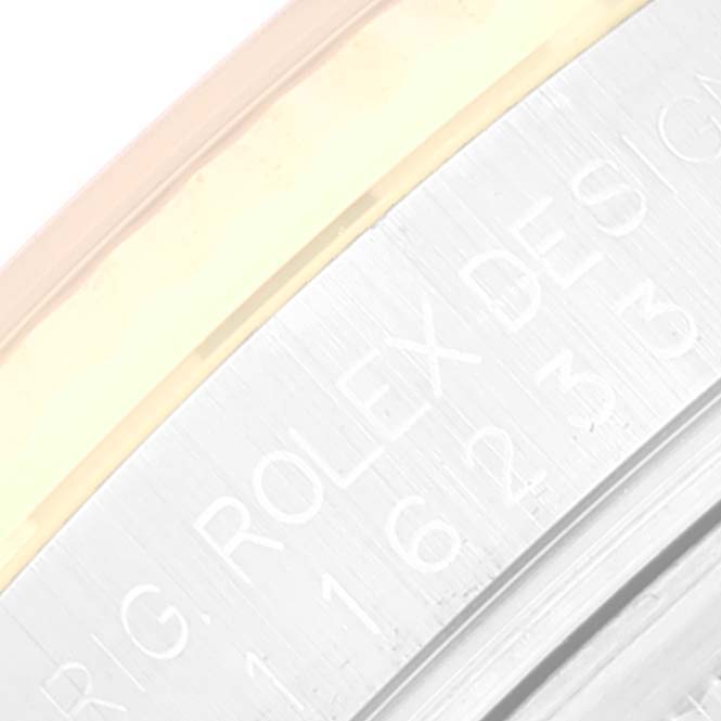 The image shows a close-up of the engraved inner bezel of a Rolex Datejust 116233 Men's Steel and Gold (two tone) Black Dial 116233 Men's Steel and Gold (two tone) Black Dial watch.
