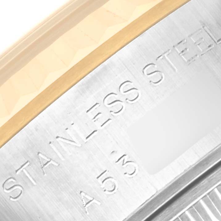 This macro shot shows the engraving on the stainless steel and gold bezel of a Rolex Datejust 79173 Women's Steel and Gold (two tone) Blue Dial 79173 Women's Steel and Gold (two tone) Blue Dial watch.