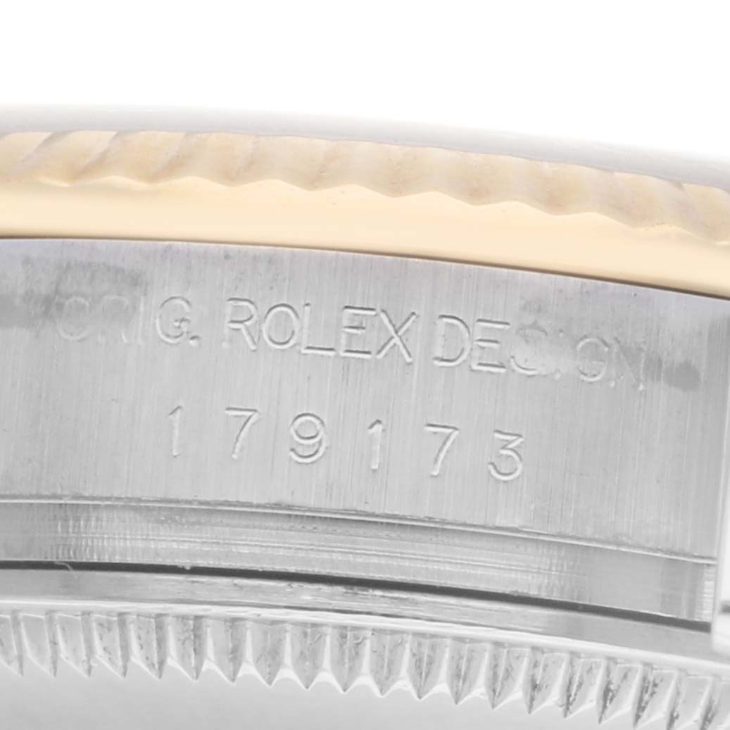 The image shows a close-up of the side of the Rolex Datejust model 179173, highlighting the engraved model number and part of the bezel.