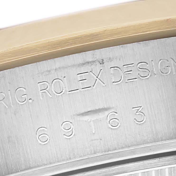 The image shows a close-up of the engraved model number and Rolex branding on the side of the casing of the Rolex Datejust 69163 Women's Steel and Gold (two tone) Grey Dial 69163 Women's Steel and Gold (two tone) Grey Dial.