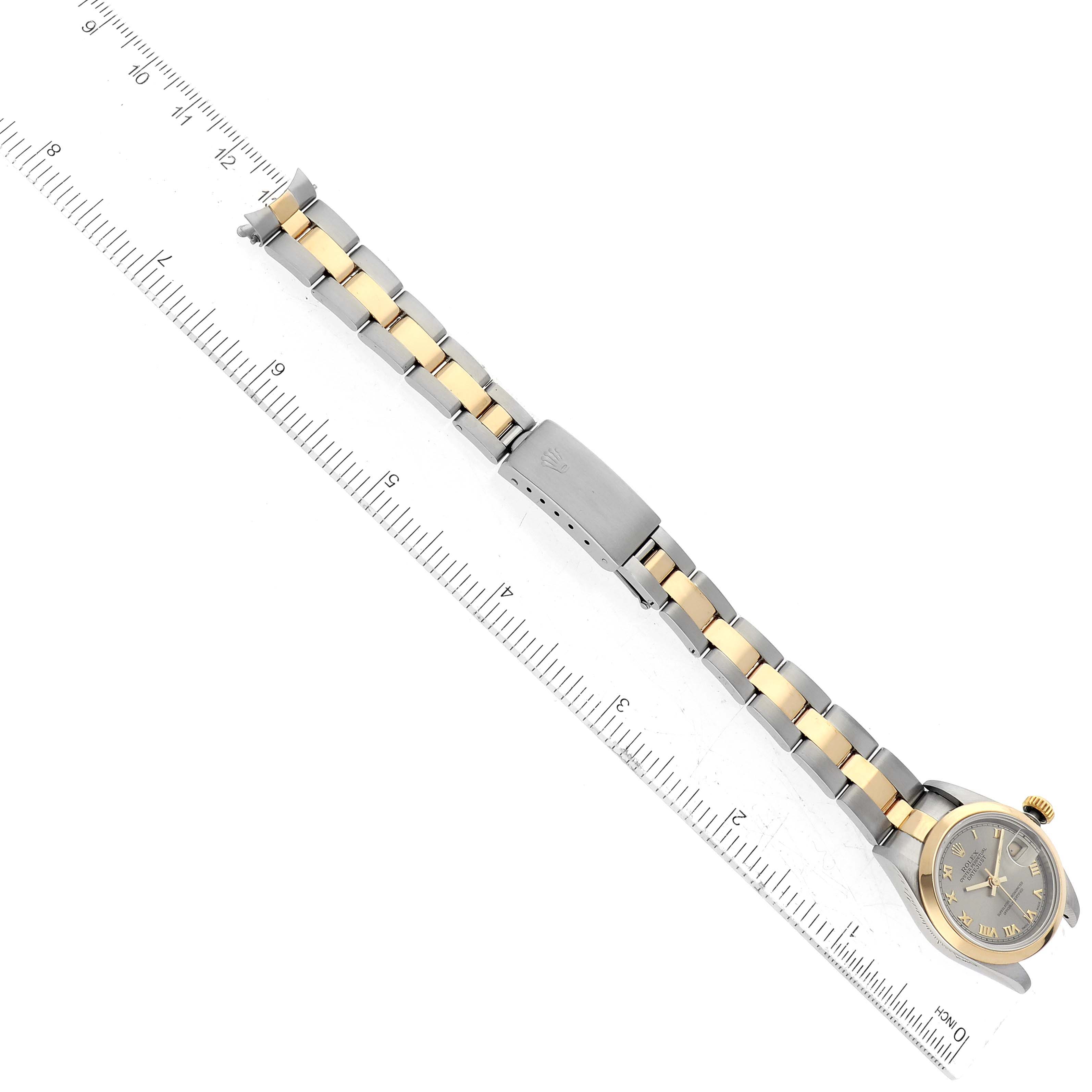 The image shows a Rolex Datejust 69163 Women's Steel and Gold (two tone) Grey Dial 69163 Women's Steel and Gold (two tone) Grey Dial watch laid flat with its band fully extended alongside a ruler for measurement.