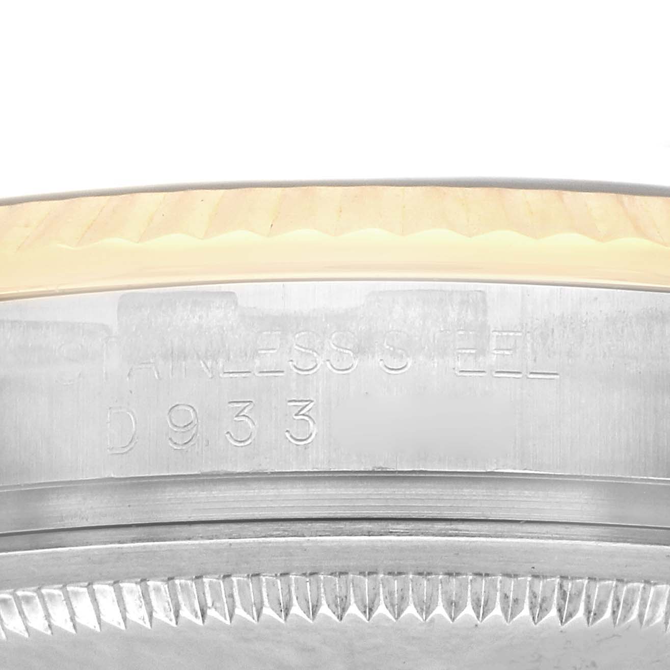 The image shows a close-up of the side of a Rolex Datejust Model 116233, focusing on the stainless steel and part of the fluted bezel.