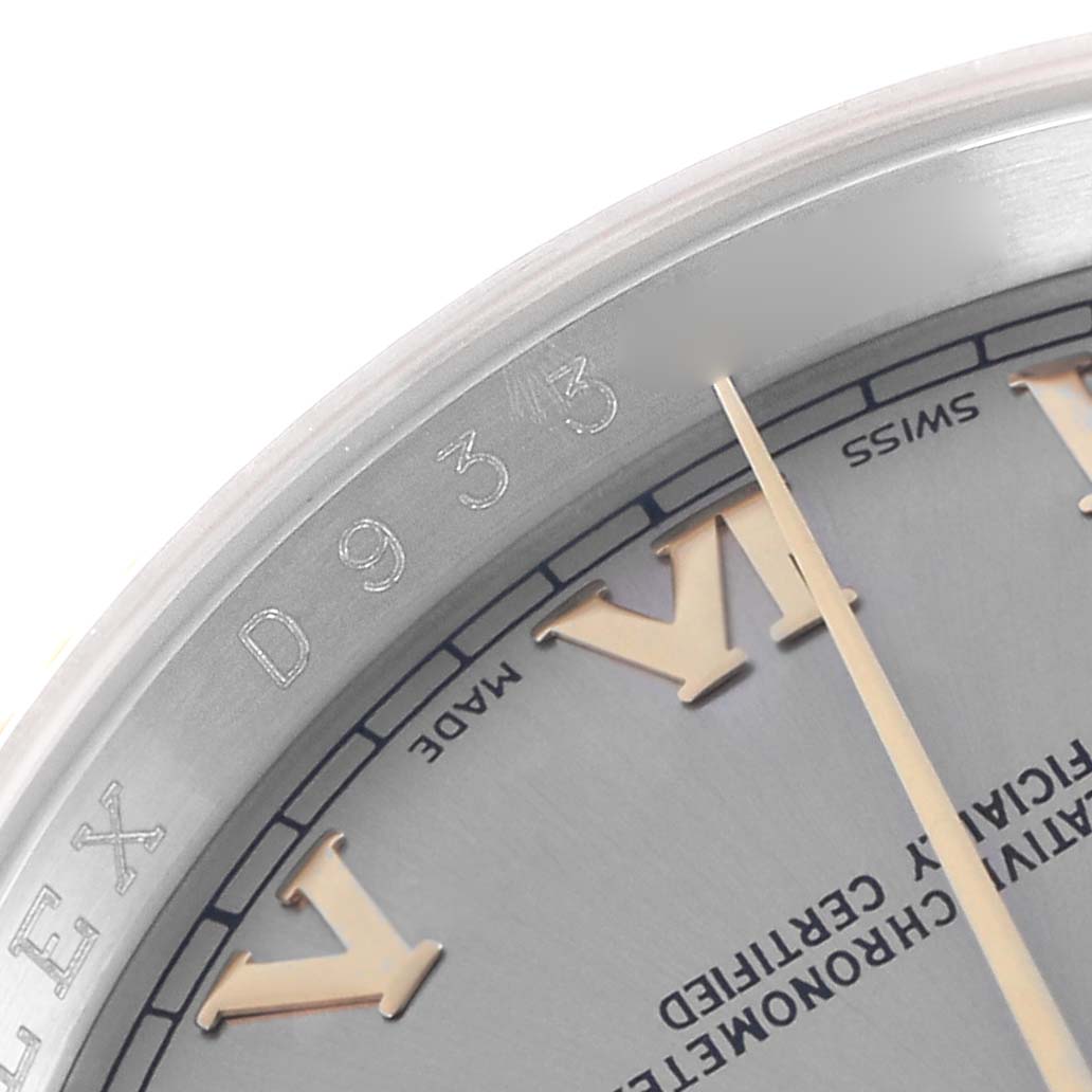 The image shows a close-up of the watch face edge and part of the dial of the Rolex Datejust model 116233, highlighting its Roman numeral and branding details.
