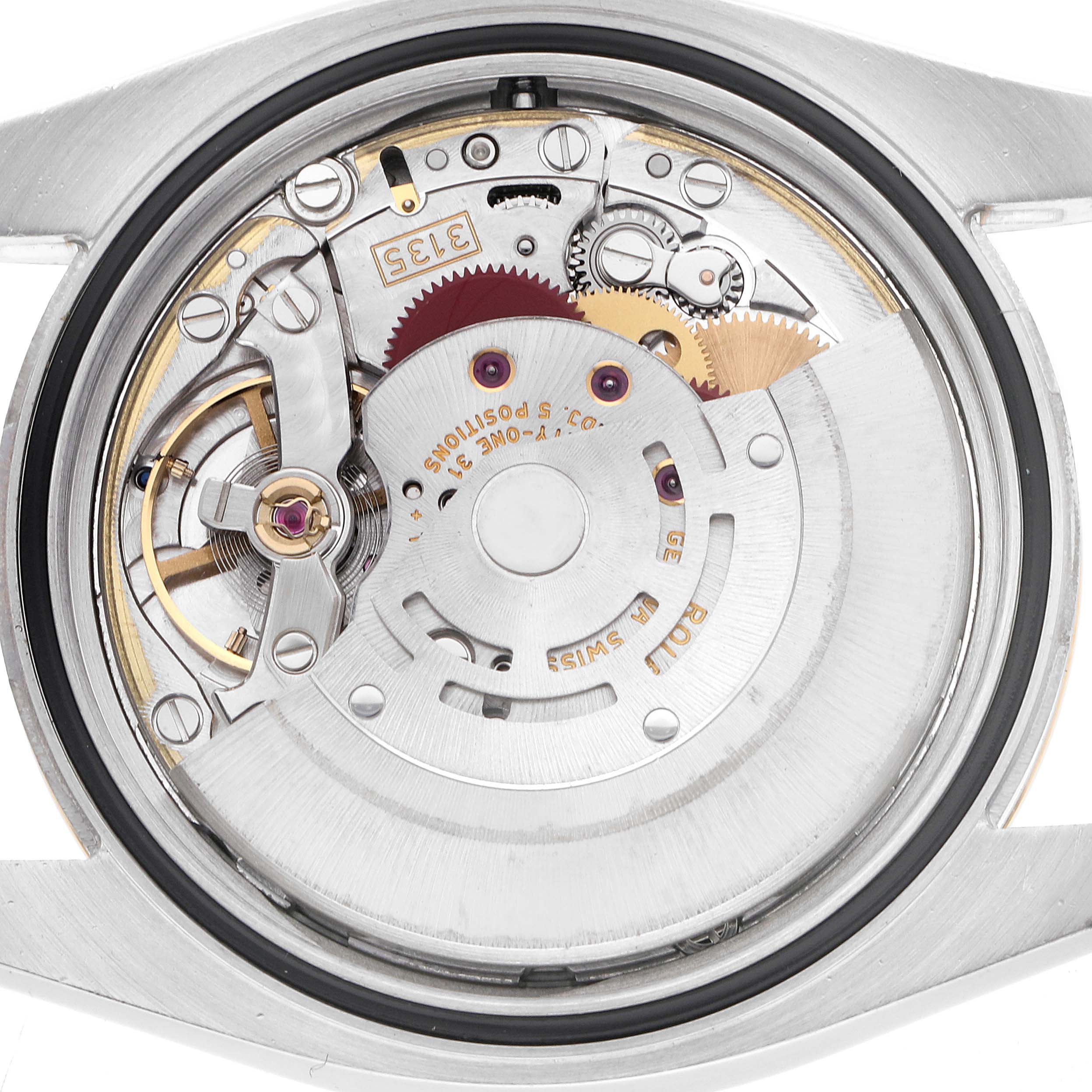 The image shows the movement of a Rolex Datejust model 116233 from the back, highlighting gears and components in detailed view.