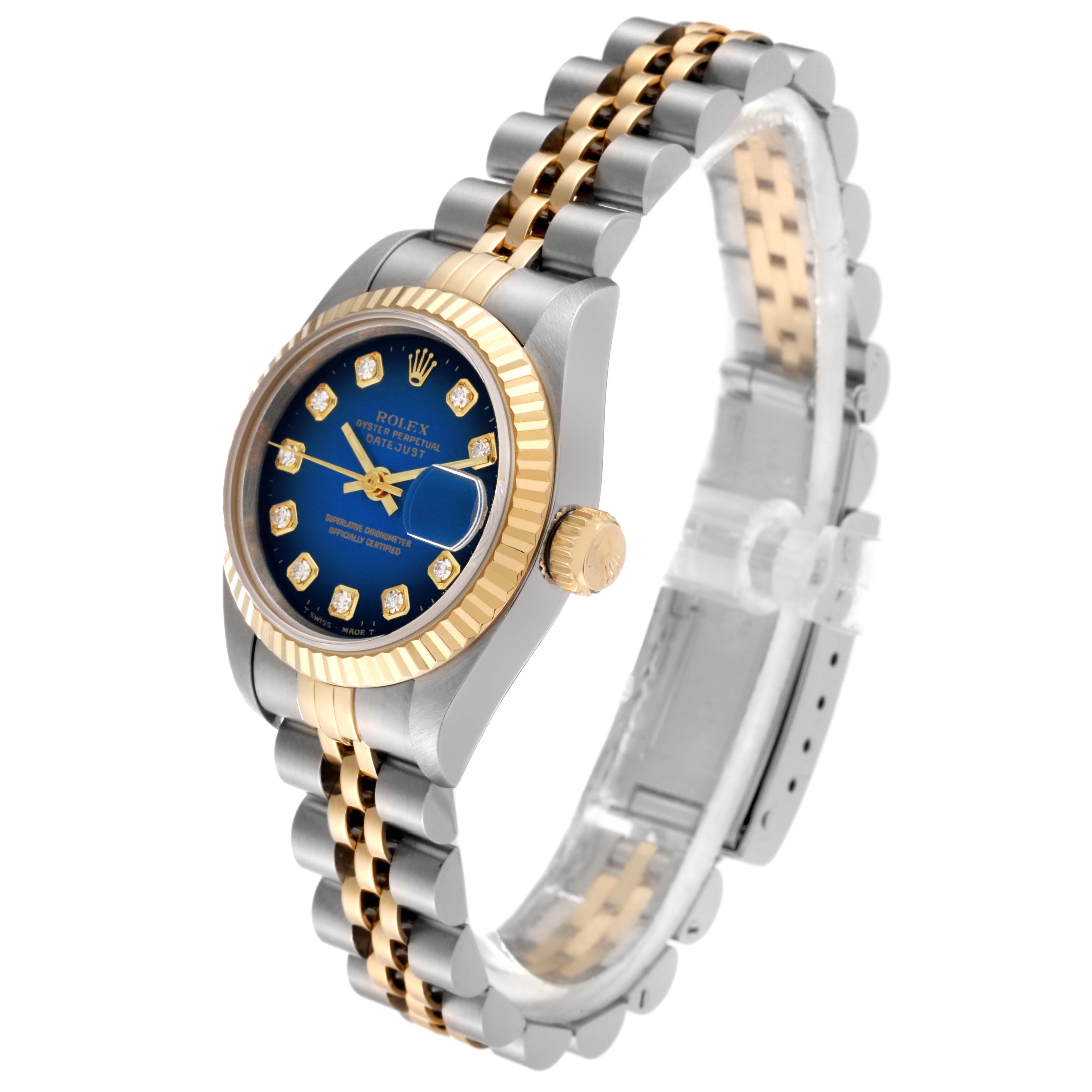 The image shows a Rolex Datejust 69173 Women's Steel and Gold (two tone) Blue Dial 69173 Women's Steel and Gold (two tone) Blue Dial watch at an angled side view, highlighting its bezel, crown, blue dial, and metal bracelet.